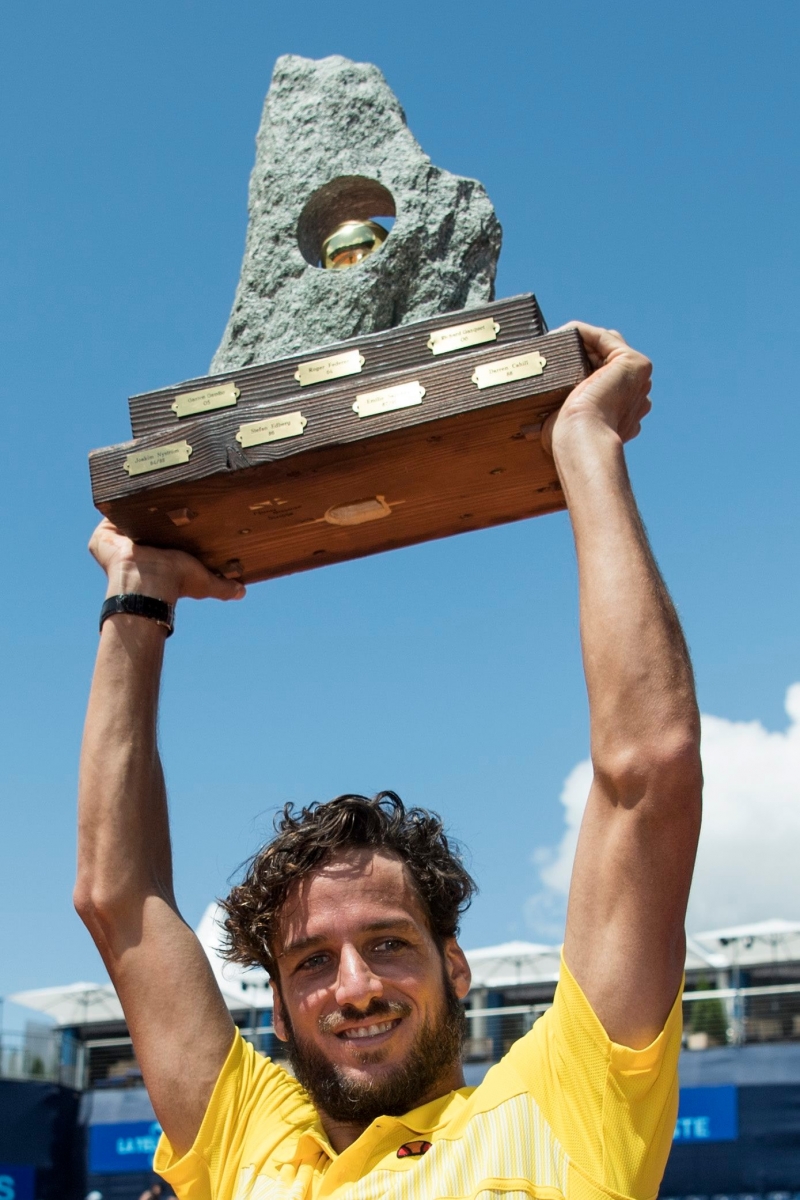 Feliciano Lopez of Spain celebrates with the trophy after the final game against Robin Haase of the Netherlands at the Suisse Open tennis tournament in Gstaad, Switzerland, Sunday, July 24, 2016. (KEYSTONE/Peter Schneider) TENNIS ATP 250 WORLD TOUR 2016 GSTAAD
