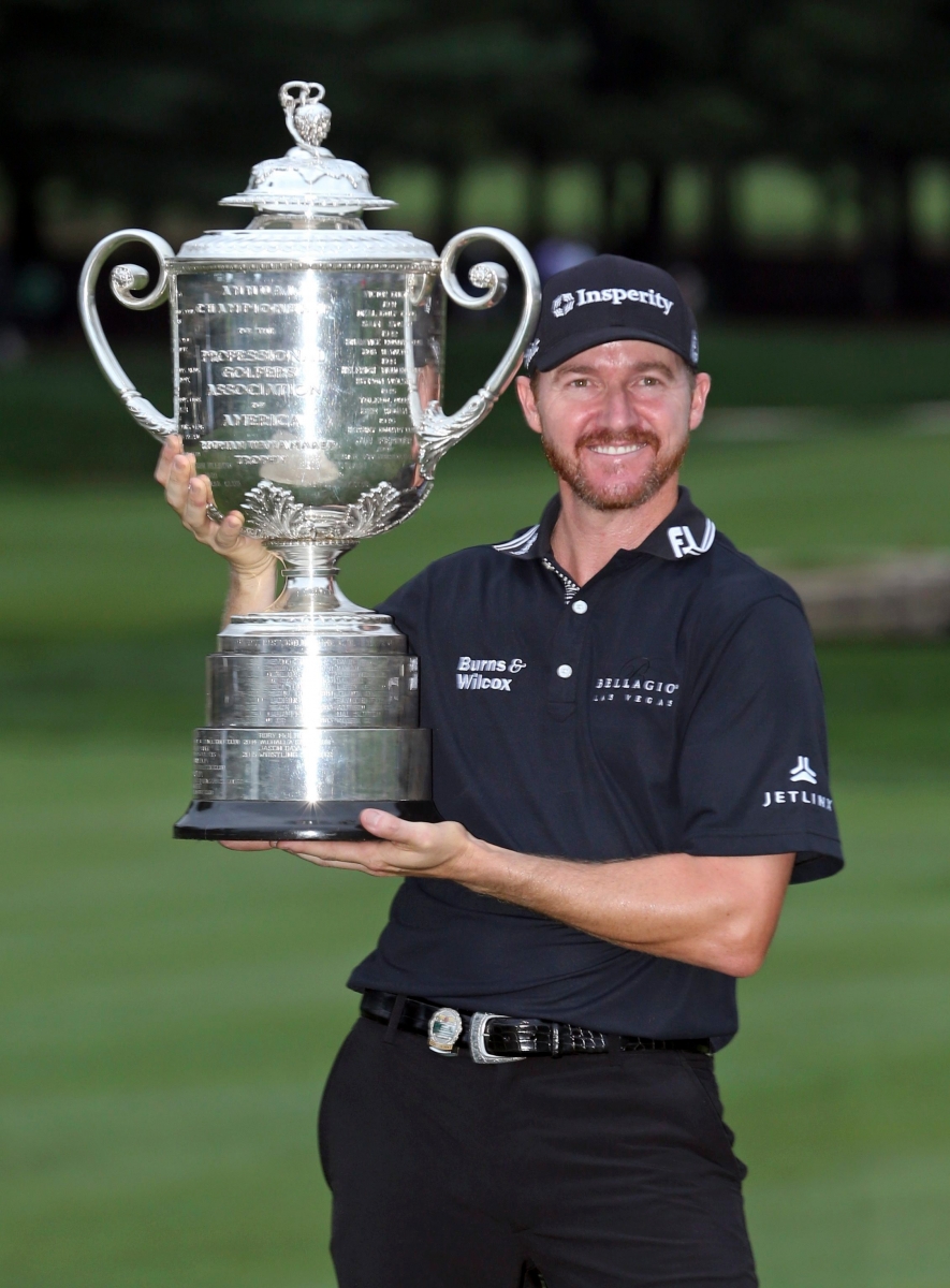 Jimmy Walker poses with the trophy after winning the PGA Championship golf tournament at Baltusrol Golf Club in Springfield, N.J., Sunday, July 31, 2016. (AP Photo/Seth Wenig) PGA Championship Golf