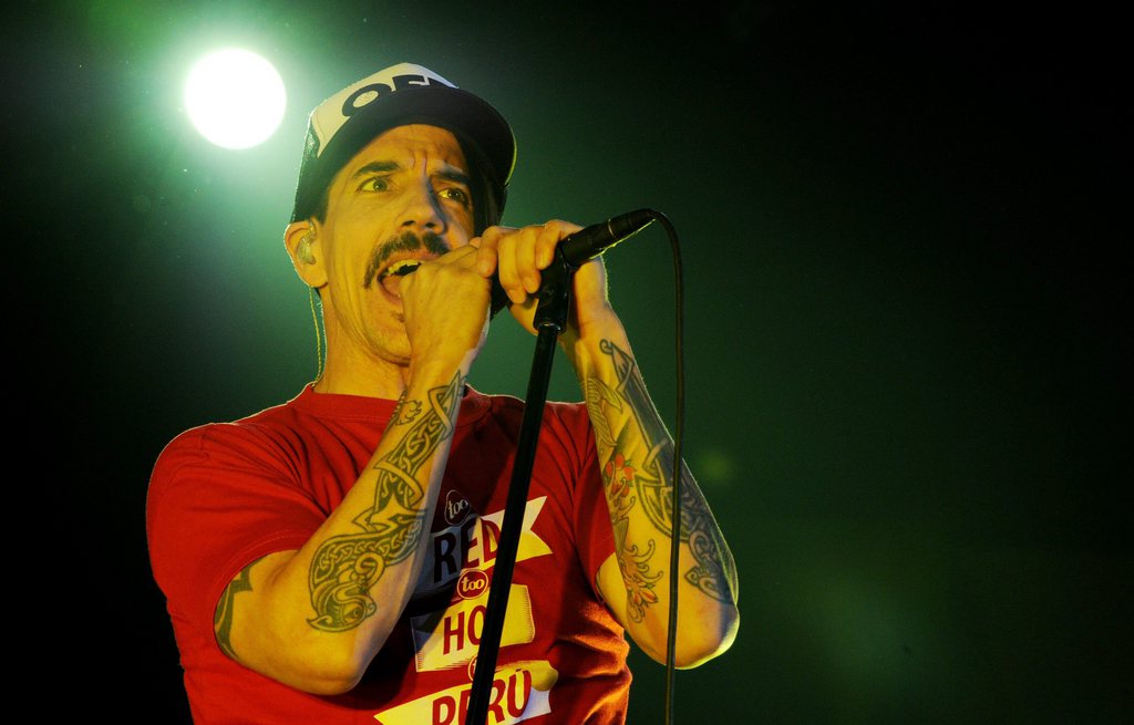 epa02959381 Anthony Kiedis, singer of the US music group Red Hot Chili Peppers, performs at the O2 World in Hamburg, Germany, 09 October 2011. The group presented  their new album 'I'm With You' at the concert.  EPA/ANGELIKA WARMUTH