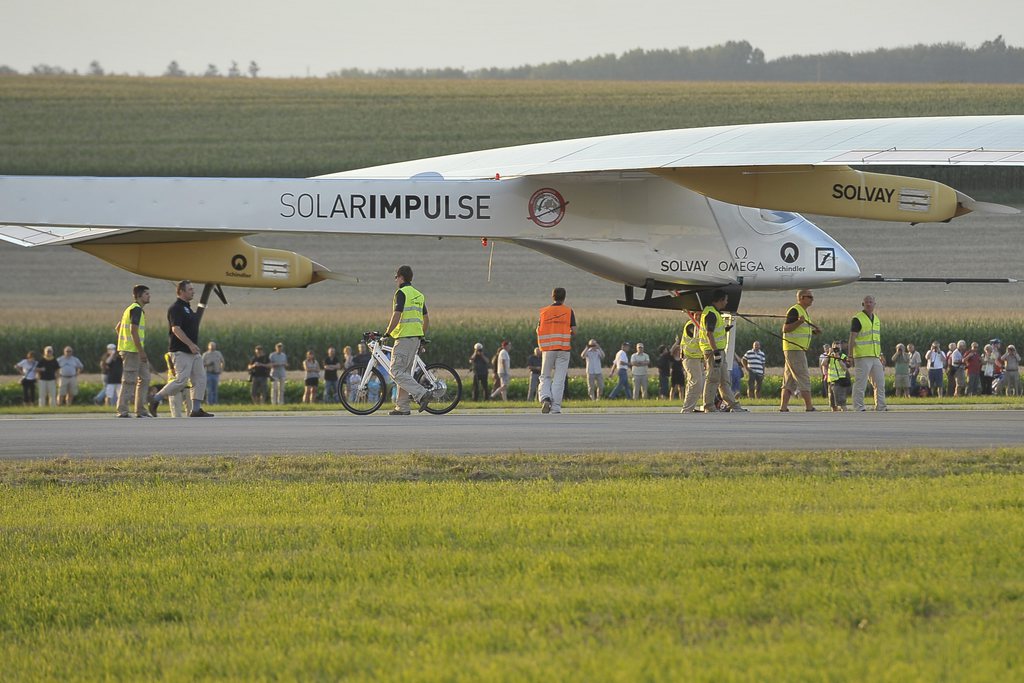 Chairman and pilot Bertand Piccard is expected after that the experimental aircraft "Solar Impulse", HB-SIA, landed at the airbase in Payerne, Switzerland, Tuesday Juli 24, 2012. Solar-powered and zero fuel aircraft Solar Impulse made a intercontinental trip with destinations in Morocco, Spain and France, with a 63.40 metres wingspan, powered only by solar energy. (KEYSTONE/Maxime Schmid)