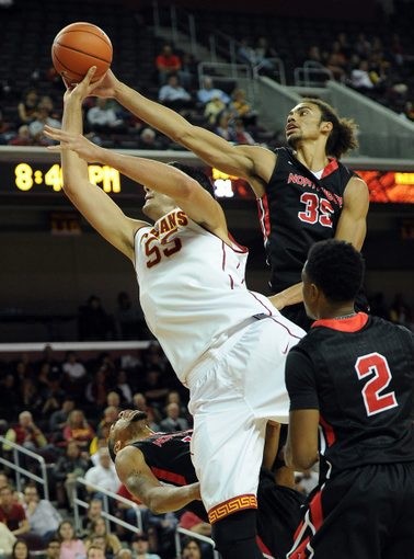 Nov 12, 2013; Los Angeles, CA, USA; USC Trojans center Omar Oraby (55) is fouled by Cal State Northridge Matadors forward/center Tre Hale-Edmerson (35) in the first half of the game at The Galen Center. Mandatory Credit: Jayne Kamin-Oncea-USA TODAY Sports