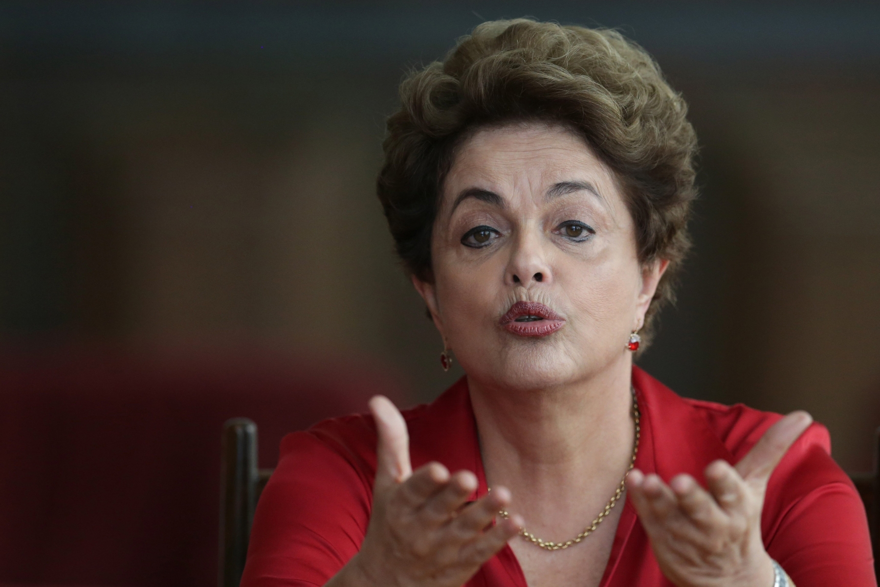 In this Thursday, Aug. 18, 2016 photo, Brazil's suspended President Dilma Rousseff speaks on the process of impeachment during a press conference for foreign correspondents, at the official residence Alvorada Palace, in Brasilia, Brazil. Rousseff made a last-ditch effort Tuesday to avoid impeachment, telling Brazilian lawmakers she would let voters decide if they want an early presidential election if she is restored to power. (AP Photo/Eraldo Peres) Week That In Was In Latin America Photo Gallery
