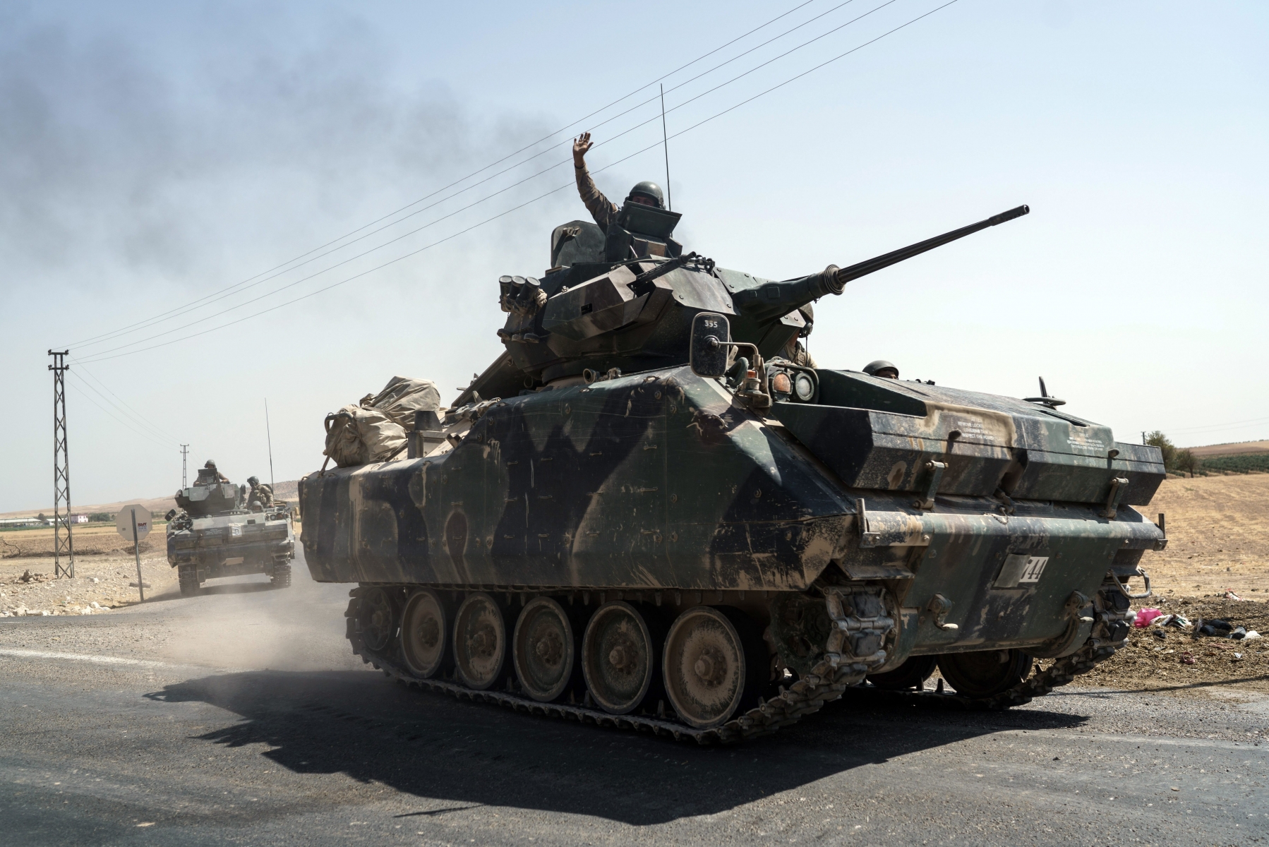 Turkish troops head to the Syrian border, in Karkamis, Turkey, Saturday, Aug. 27, 2016. Turkey on Wednesday sent tanks across the border to help Syrian rebels retake the key Islamic State-held town of Jarablus and to contain the expansion of Syria's Kurds in an area bordering Turkey. (AP Photo/Halit Onur Sandal) Turkey Syria
