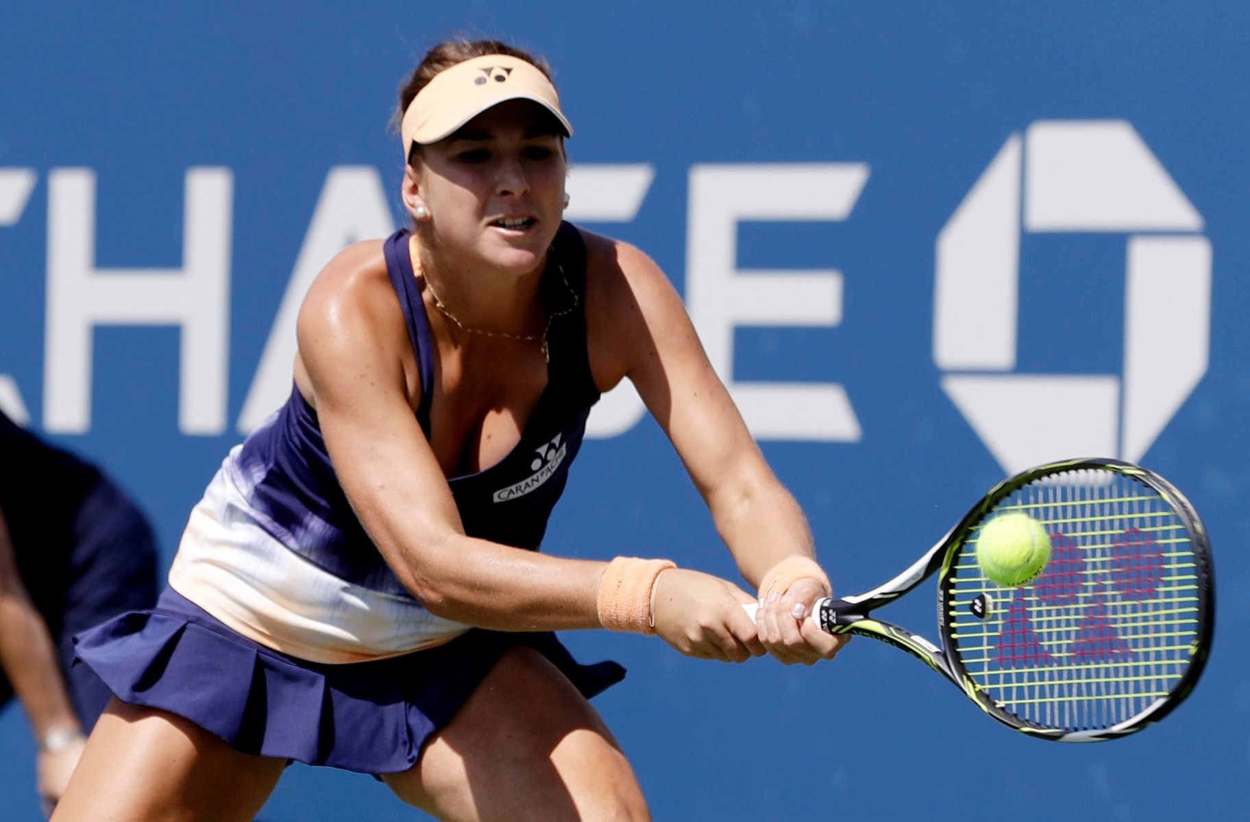 Belinda Bencic, of Switzerland, returns a shot to Samantha Crawford, of the United States, during the first round of the U.S. Open tennis tournament, Monday, Aug. 29, 2016, in New York. (AP Photo/Seth Wenig) US Open Tennis
