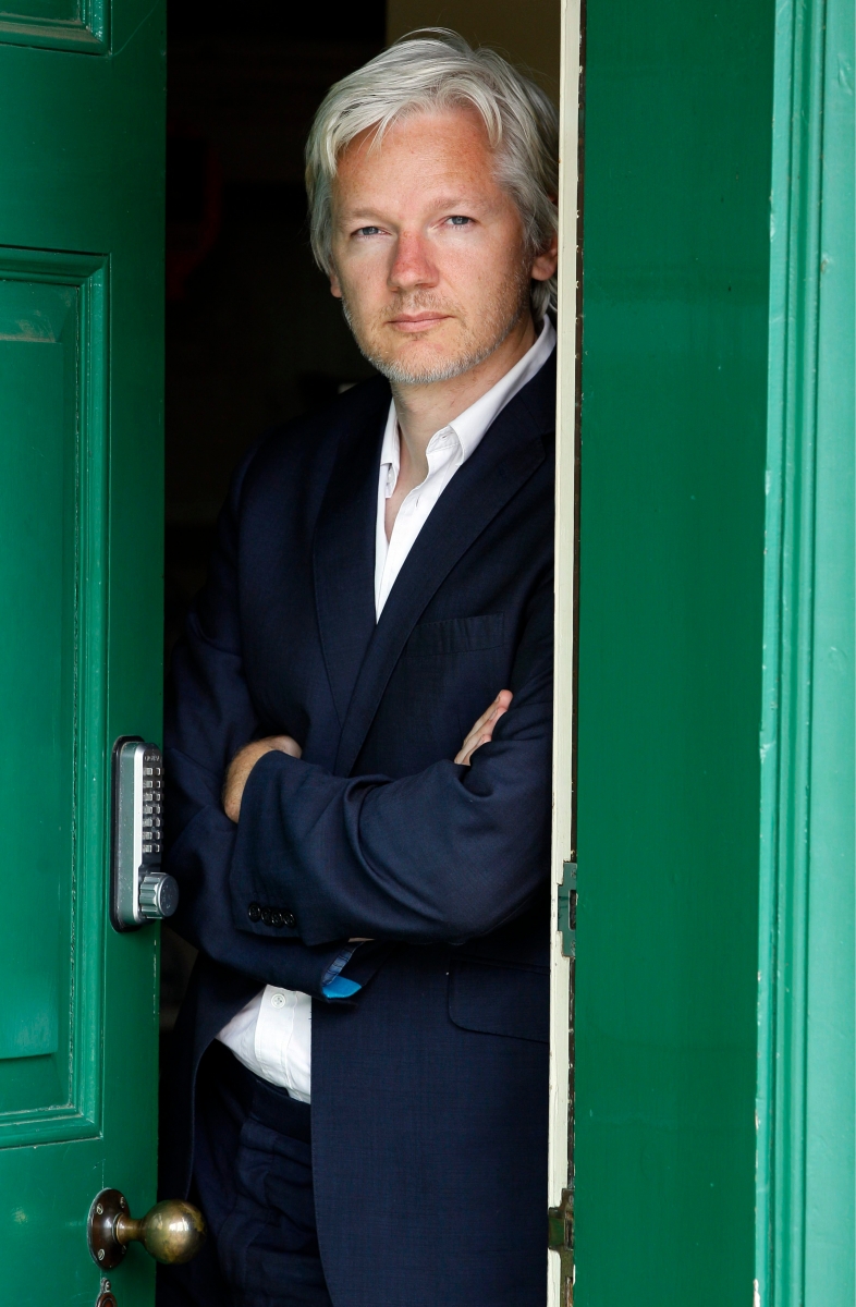 WikiLeaks founder Julian Assange is seen at the house where he is required to stay in, near Bungay, England, Wednesday, June 15, 2011. Assange says his house arrest over sex allegations is hampering the work of the secret-spilling site, and his supporters accuse Britain of spying on him.  The 39-year-old Australian has spent six months at a supporter's rural estate as he fights extradition to Sweden, where he is accused of the rape and sexual assault of two women (AP Photo/Kirsty Wigglesworth) Britain WikiLeaks