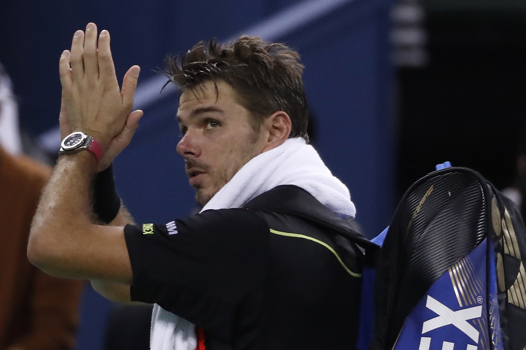 Stan Wawrinka of Switzerland gestures as he leaves the court after defeat by Giles Simon of France in the men's singles match of the Shanghai Masters tennis tournament at Qizhong Forest Sports City Tennis Center in Shanghai, China, Thursday, Oct. 13, 2016. (AP Photo/Andy Wong) China Tennis Shanghai Masters