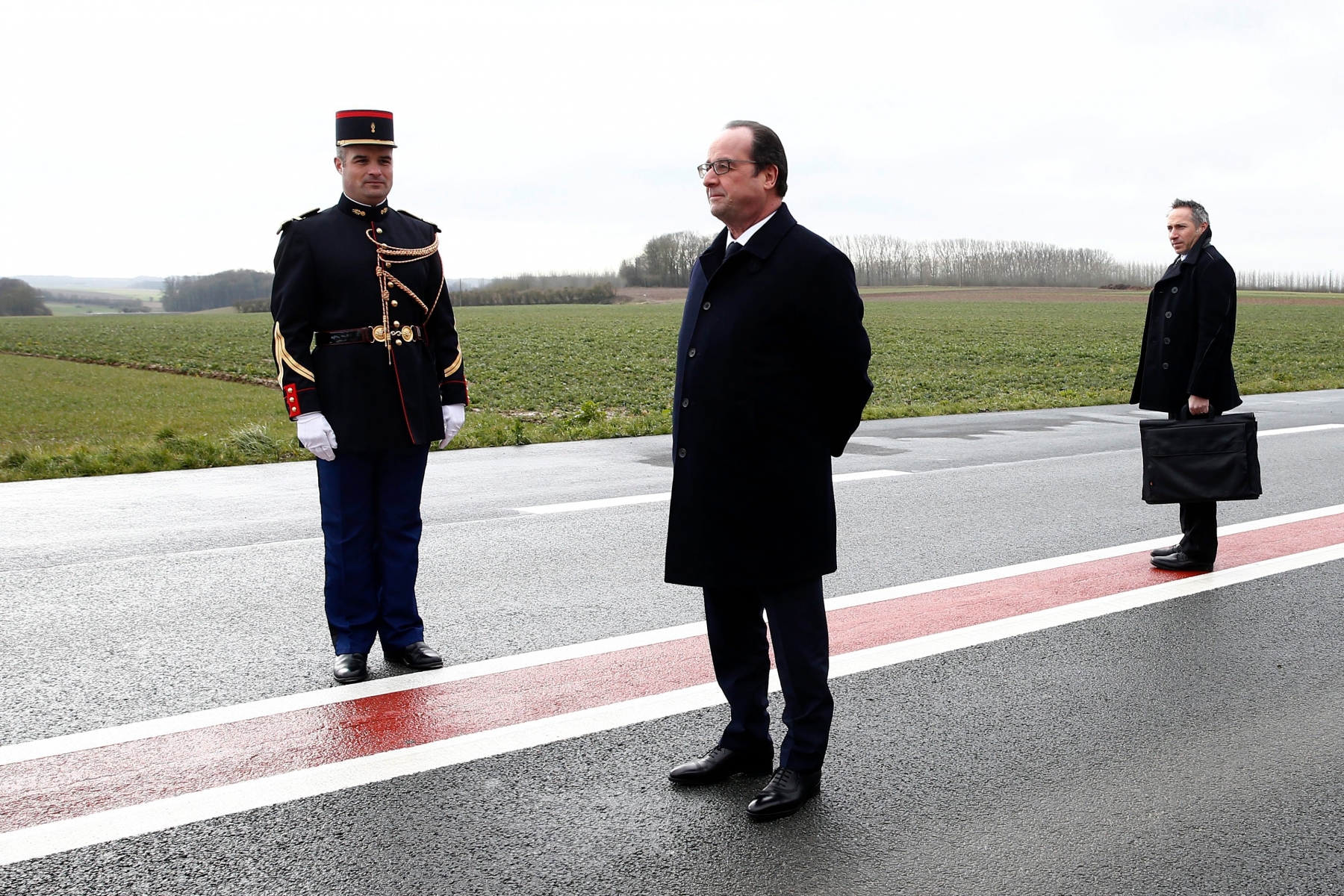 epa05192339 French President Francois Hollande (R) waits for the British Prime Minister David Cameron (not pictured) to arrive outside the Pozieres British Memorial as part of the 34th Franco-British summit, in Pozieres, near Amiens, France, 03 March 2016. The centenary of the Battle of the Somme will be commemorated in 2016. The migrant crisis in Calais will be discussed at the 34th Franco-British summit.  EPA/YOAN VALAT / POOL MAXPPP OUT FRANCE BRITAIN DIPLOMACY