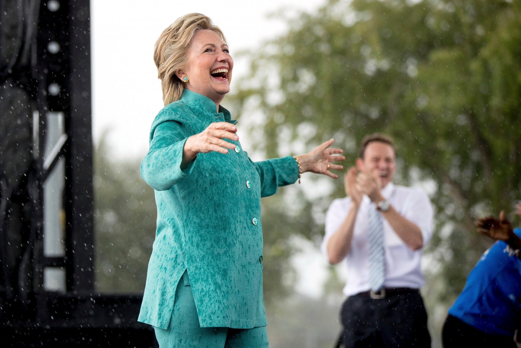 Democratic presidential candidate Hillary Clinton smiles as she cuts her speech short due to rain at a rally at C.B. Smith Park in Pembroke Pines, Fla., Saturday, Nov. 5, 2016. (AP Photo/Andrew Harnik) Campaign 2016 Clinton
