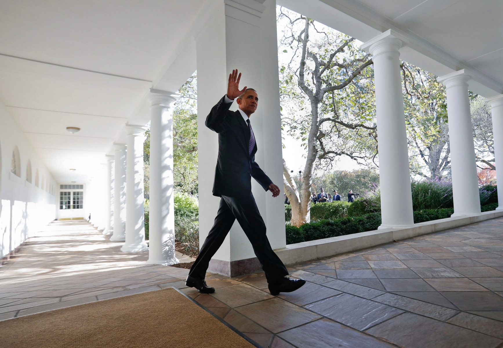 President Barack Obama waves as he walks down the White House Colonnade from the main residence to the Oval Office Tuesday, Nov. 8, 2016 in Washington. (AP Photo/Pablo Martinez Monsivais) 2016 Election Obama