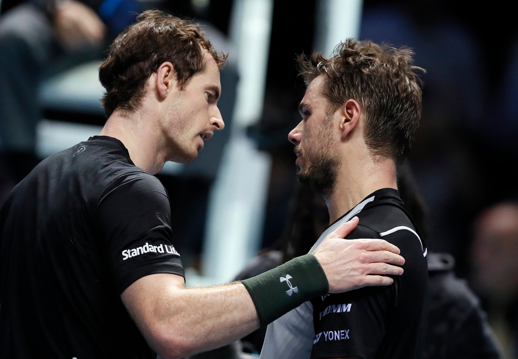 Winner Andy Murray of Britain, left, comforts Stan Wawrinka of Switzerland after their ATP World Tour Finals singles tennis match at the O2 Arena in London, Friday, Nov. 18, 2016. (AP Photo/Kirsty Wigglesworth) Britain Tennis ATP Finals