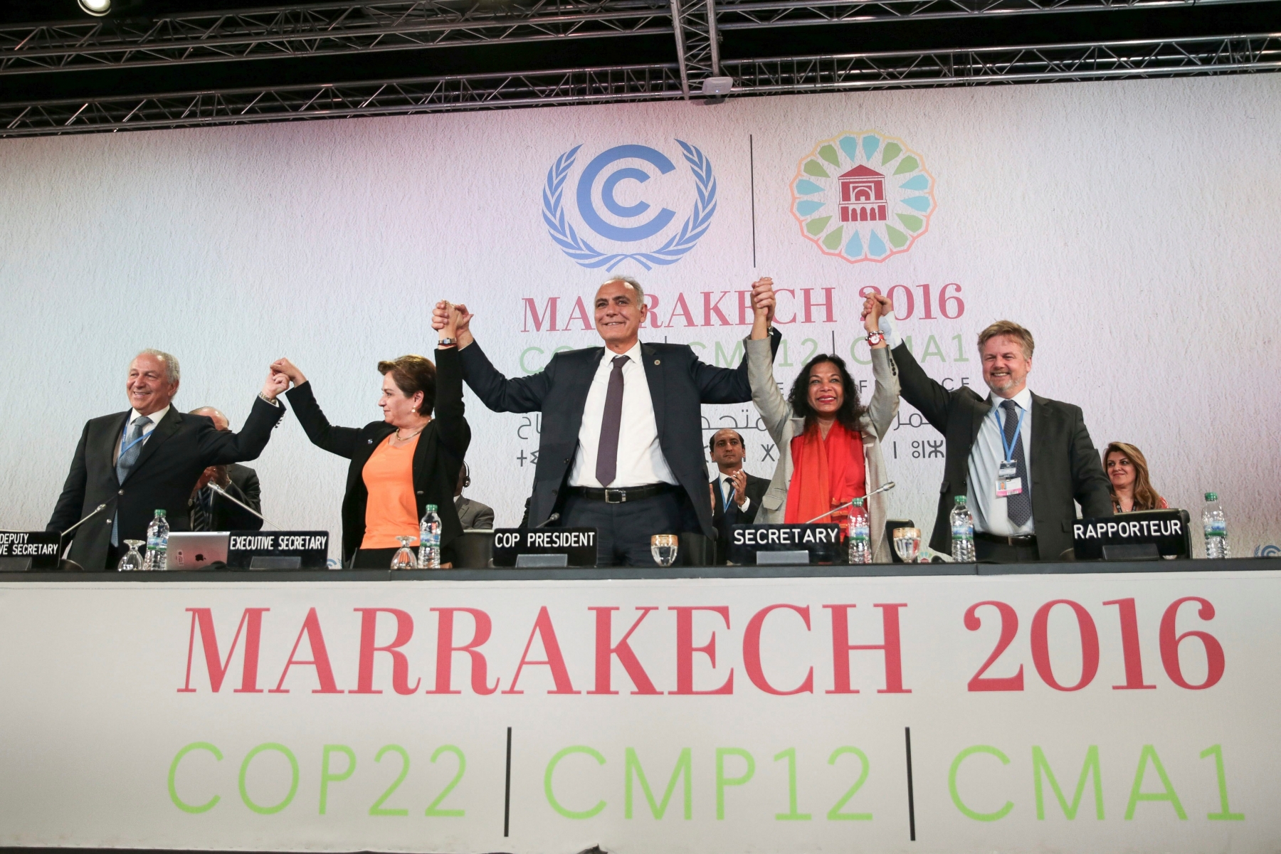 U.N. climate chief Patricia Espinosa, 2nd left, and Morocco's Foreign Minister Salaheddine Mezouar, centre, celebrate after the proclamation of Marrakech, at the COP22 climate change conference, in Marrakech, Morocco, Thursday, Nov. 17, 2016. Governments meeting for U.N. climate talks have reiterated their commitment to the Paris Agreement with a proclamation saying climate action is "irreversible," the buzzword at the two-week conference after the uncertainty caused by the U.S. election. (AP Photo/Mosa'ab Elshamy) APTOPIX Morocco UN Climate Talks