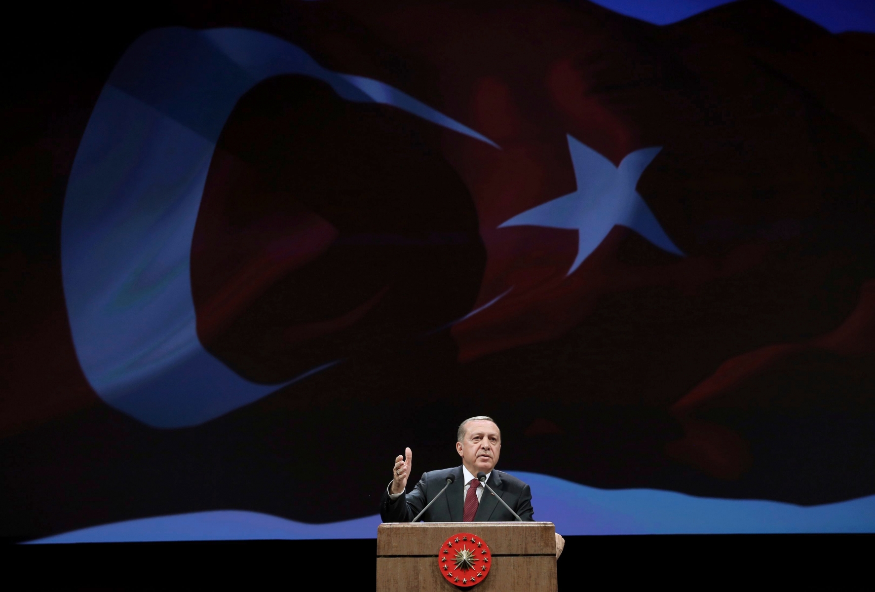 Turkey's President addresses police officers in Ankara, Turkey, Tuesday, Nov. 22, 2016. Turkey's government on Tuesday dismissed a further 15,000 people from the military, police and the civil service as part of an ongoing investigation into the failed military coup in July. Erdogan said Tuesday that the civil service was still not entirely purged of U.S.-based Muslim cleric Fethullah Gulen's followers and vowed take all measures necessary to eradicate the group. (Murat Cetinmuhurdar, Presidential Press Service, Pool photo via AP) Turkey Failed Coup