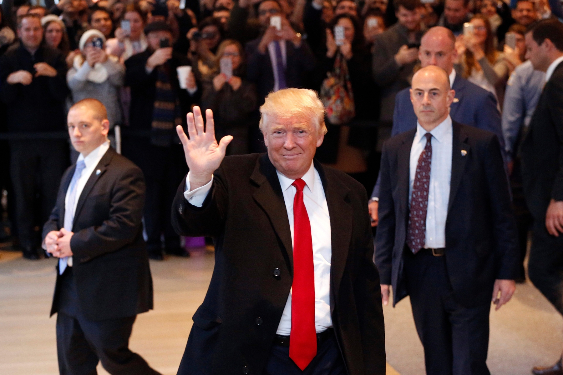 President-elect Donald Trump waves to the crowd as he leaves the New York Times building following a meeting, Tuesday, Nov. 22, 2016, in New York. (AP Photo/Mark Lennihan) Trump New York Times