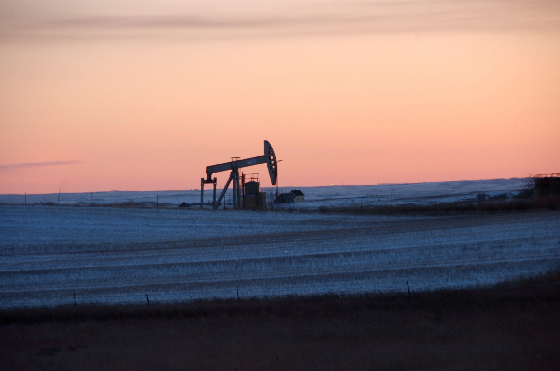 In this Feb. 25, 2015 photo, a pump jack for pulling oil from the ground is seen near New Town, N.D. A team led by researchers at the University of Michigan has found that fossil fuel production at the Bakken Formation in North Dakota and Montana is emitting roughly 2 percent of the ethane detected in the Earth's atmosphere. Along with its chemical cousin methane, ethane is a hydrocarbon that is a significant component of natural gas. Once in the atmosphere, ethane reacts with sunlight to form ozone.(AP Photo/Matthew Brown) Ethane Pollution