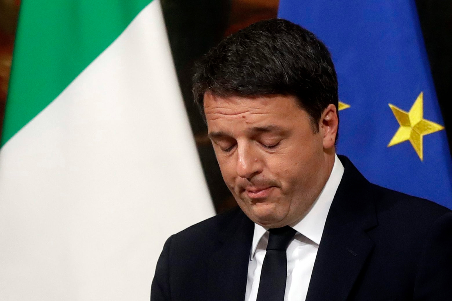 Italian Premier Matteo Renzi speaks during a press conference at the premier's office Chigi Palace in Rome, early Monday, Dec. 5, 2016. Renzi acknowledged defeat in a constitutional referendum and announced he will resign on Monday. Italians voted Sunday in a referendum on constitutional reforms that Premier Matteo Renzi has staked his political future on. (AP Photo/Gregorio Borgia) Italy Referendum