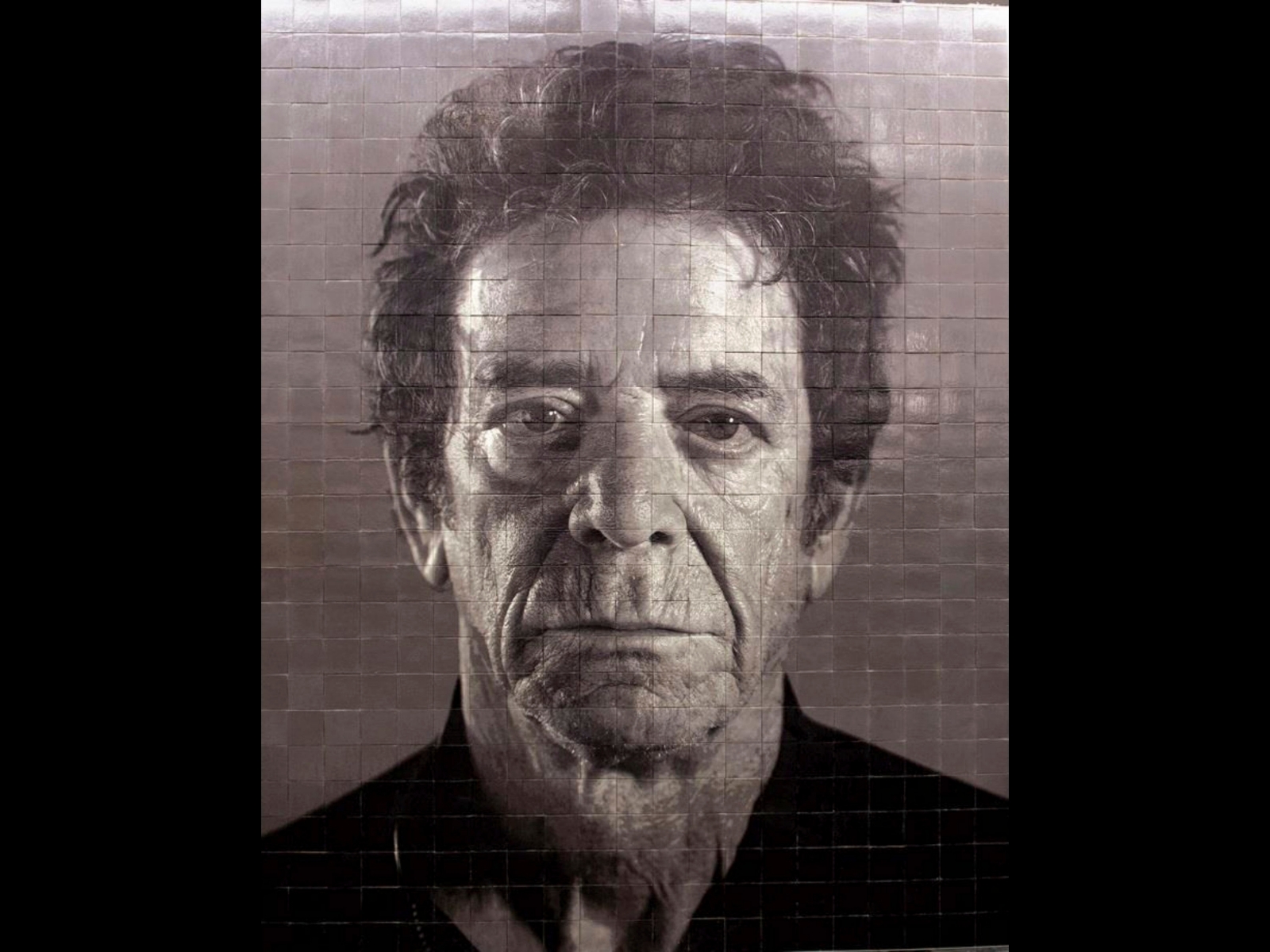This 2016 photo provided by the Office of New York Gov. Andrew M. Cuomo shows a mosaic by Chuck Close of Lou Reed in the 86th St. station of the Second Avenue subway line in New York. The line, which opens Jan. 1, 2017, will have four stations, each with walls decorated with ceramic-tile or mosaic pieces by one of the four artists: Chuck Close, Sarah Sze, Jean Shin and Vik Muniz. (MTA/Office of New York Gov. Cuomo via AP) Second Avenue Subway Public Art