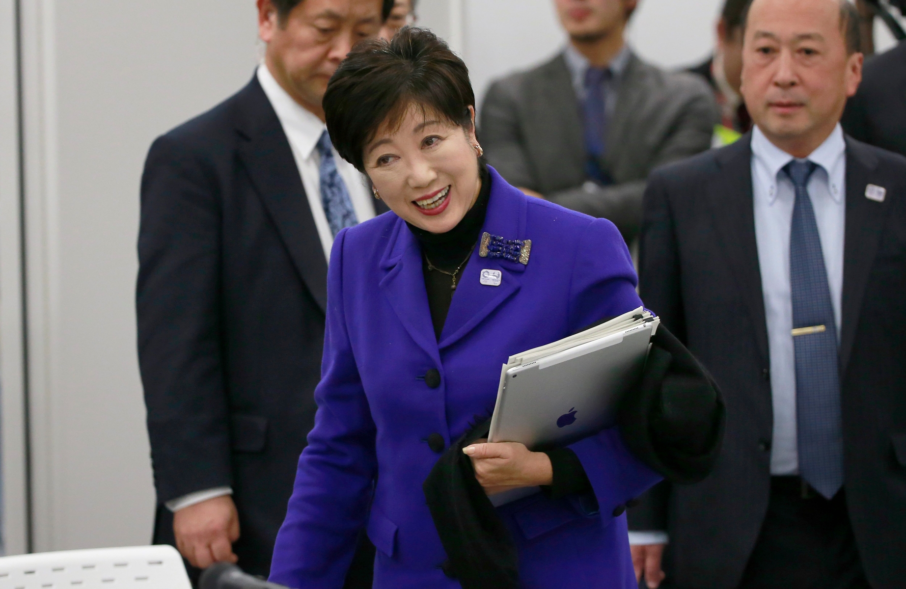 Tokyo Gov. Yuriko Koike arrives at the Four-Party Working Group meeting in Tokyo, Wednesday, Dec. 21, 2016. Japanese Olympic organizers presented their first official cost estimate for the 2020 Tokyo Games at a level slightly below their promised 2 trillion ($17 billion) cap. (AP Photo/Shizuo Kambayashi) Japan Olympics Tokyo 2020 Venues