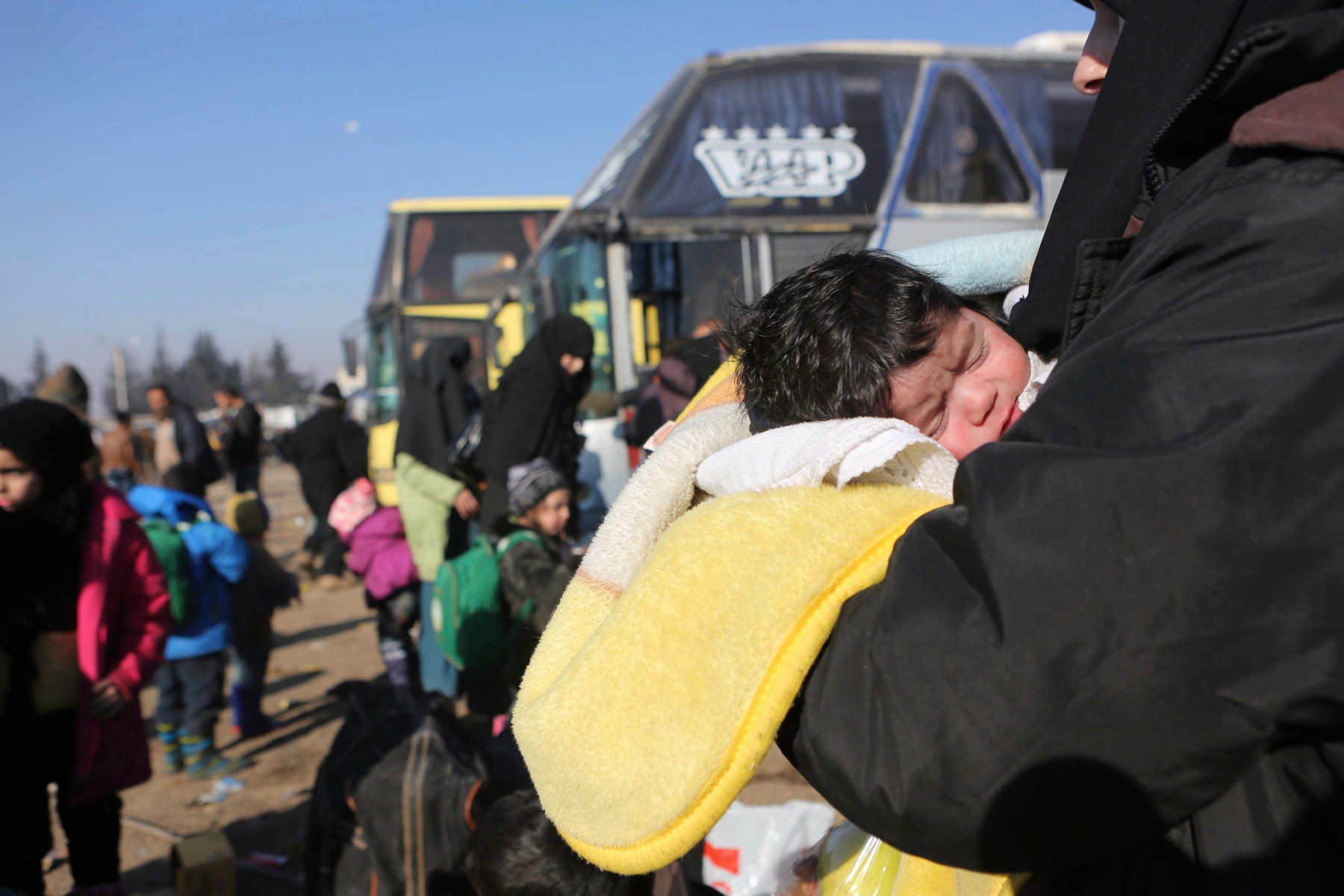 Syrians evacuated from the embattled Syrian city of Aleppo during the ceasefire arrive at a refugee camp in Rashidin, near Idlib, Syria, Tuesday, Dec. 20, 2016. Russian Foreign Minister Sergey Lavrov said on Tuesday that Russia, Iran and Turkey are ready to act as guarantors in a peace deal between the Syrian government and the opposition. He spoke on Tuesday after a meeting of the three countries' foreign ministers in Moscow. (AP Photo) Syria Russia Turkey