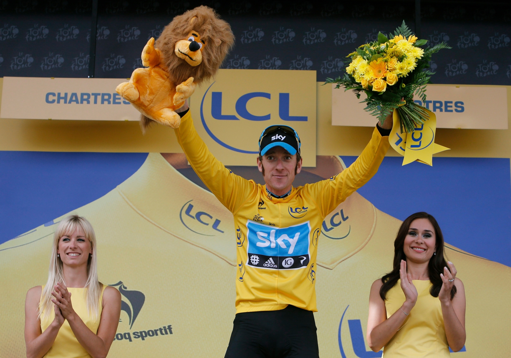 File - In this Saturday, July 21, 2012 file photo, Bradley Wiggins of Britain, wearing the overall leader's yellow jersey, bows to cheering spectators on the podium of the 19th stage of the the Tour de France cycling race, an individual time trial over 53.5 kilometers (33.2 miles) with start in Bonneval and finish in Chartres, France. Bradley Wiggins announced his retirement from cycling on Wednesday, Dec. 28, 2016 ending an illustrious career in which he won a British-record eight Olympic medals and became his countryÄôs first winner of the Tour de France. (AP Photo/Laurent Cipriani) Cycling Wiggins Retires
