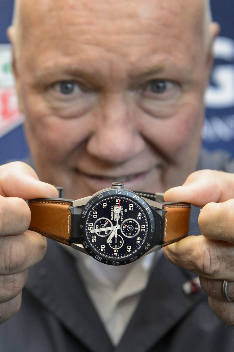 TAG Heuer CEO and President of LVMH Watch Division, Jean-Claude Biver, poses with the new titanium Carrera Connected watch during a press event at the TAG Heuer headquarters, in La Chaux-de-Fonds, Switzerland, Thursday, December 3, 2015. (KEYSTONE/Jean-Christophe Bott)