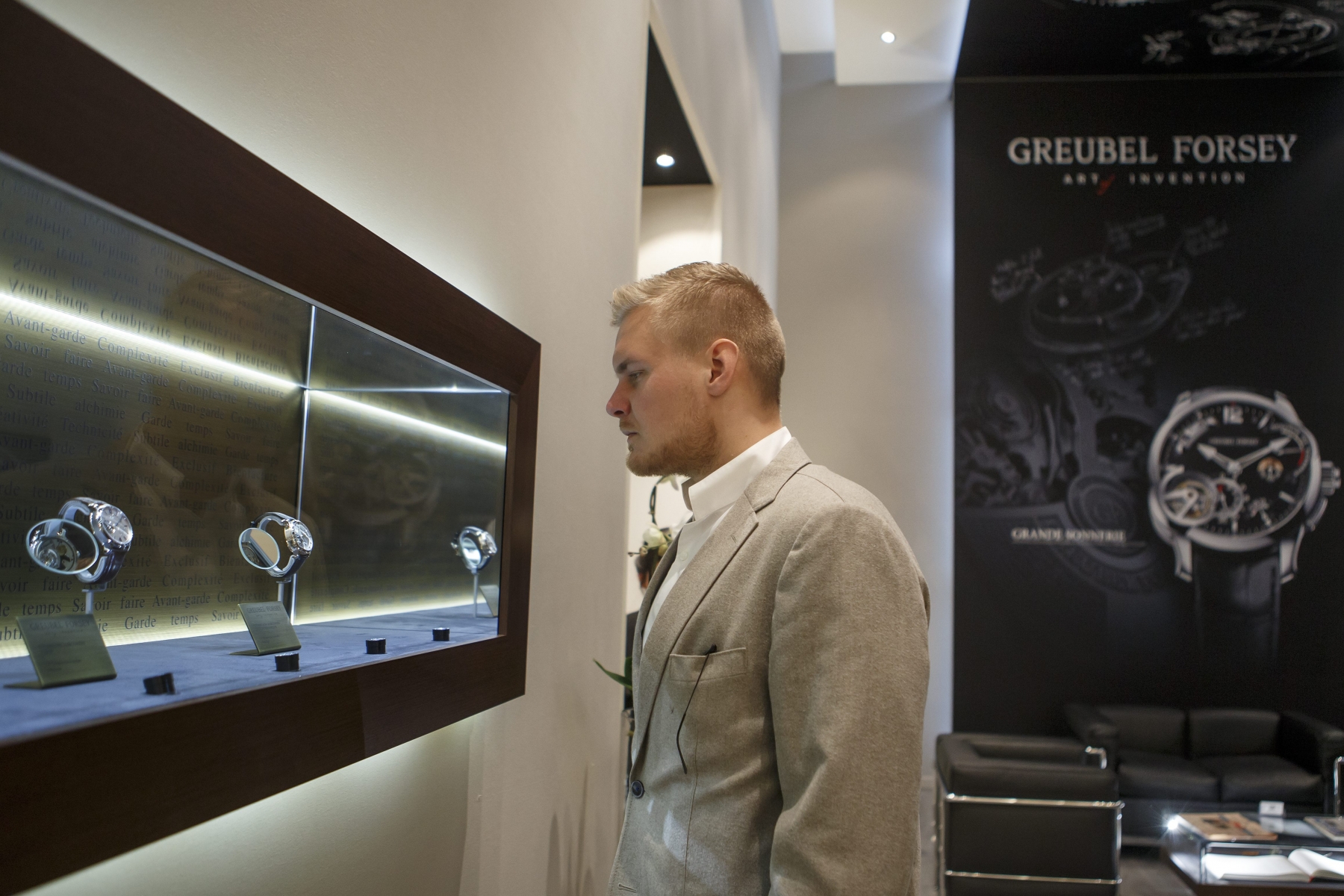 A visitor looks on watches at the Greubel Forsey booth, during the first day of the 27th edition of the Salon International de la Haute Horlogerie, SIHH, in Geneva, Switzerland, on Monday, January 16, 2017. (KEYSTONE/Salvatore Di Nolfi)