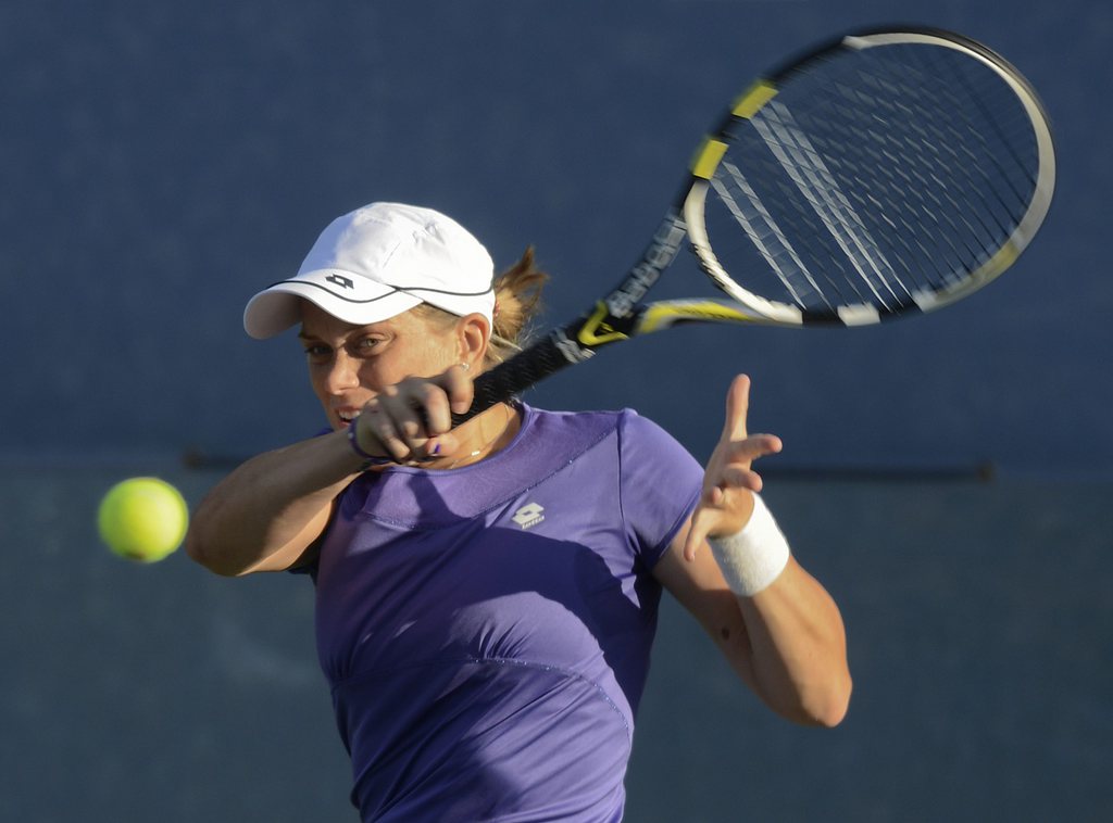 Romina Oprandi of Switzerland returns a shot against Marion Bartoli of France in the second round of play at the 2012 US Open tennis tournament,  Wednesday, Aug. 29, 2012, in New York. (AP Photo/Henny Ray Abrams)