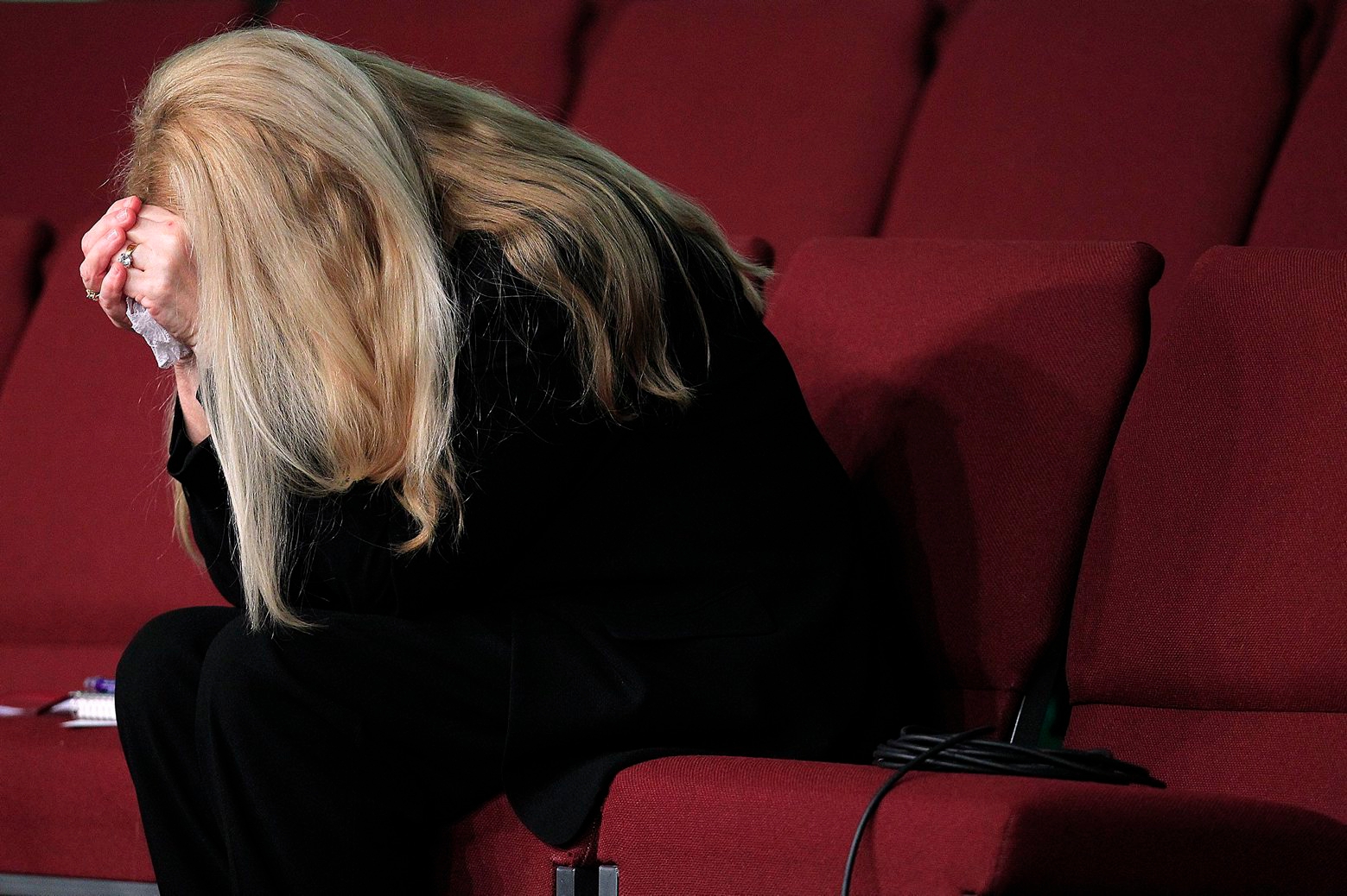 Gayle Inge, mother of Mindy McCready, prays with the congregation at the end of the funeral service for her daughter at the Crossroads Baptist Church in Fort Myers, Fla., on Tuesday, Feb. 26, 2013.  McCready committed suicide Feb. 17 at her home in Arkansas, days after leaving a court-ordered substance abuse program. (AP Photo/Naples Daily News, Corey Perrine)  FORT MYERS OUT Mindy McCready Funeral