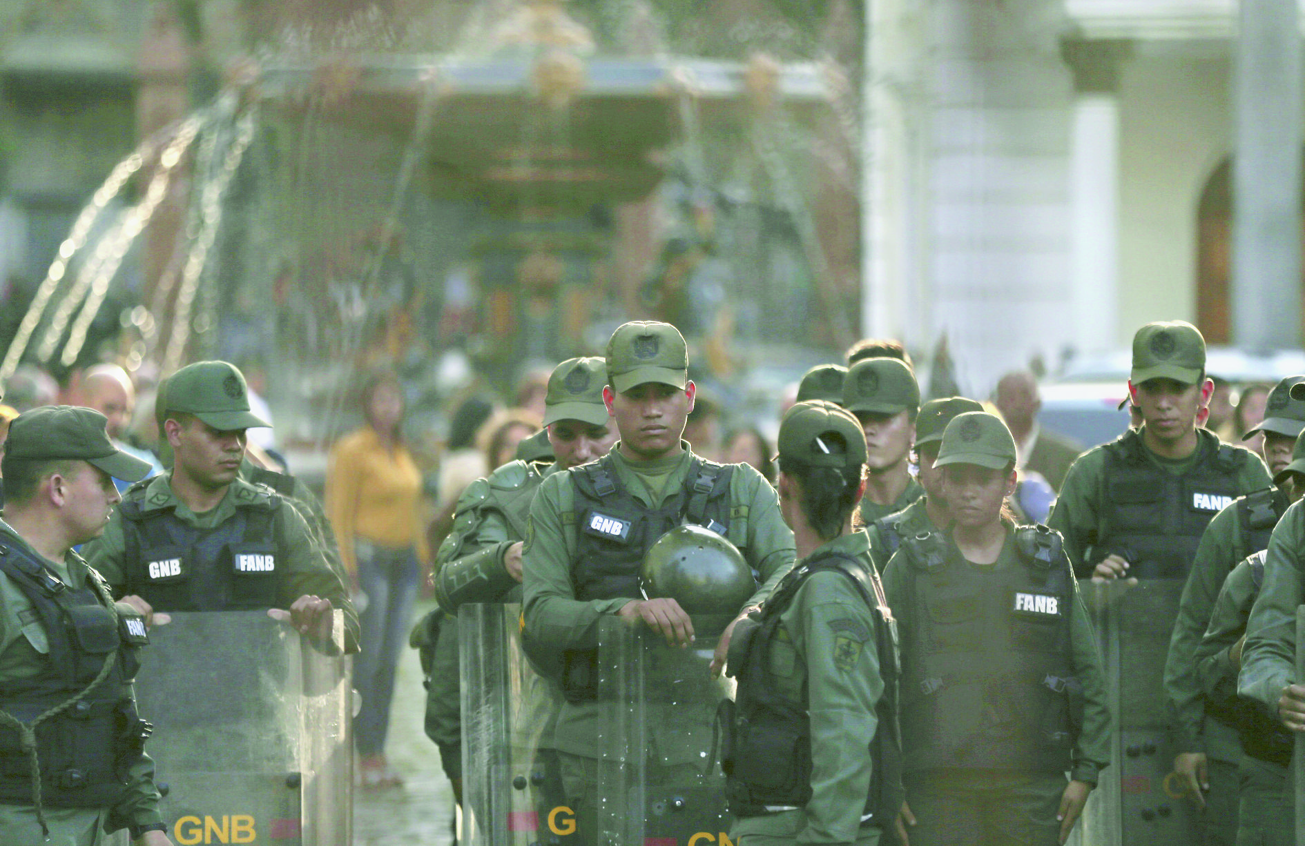 Venezuelan Bolivarian National Guard soldiers dressed in riot gear lineup inside of National Assembly building in Caracas, Venezuela, Tuesday, June 27, 2017. Opposition lawmakers got into fisticuffs with national guardsmen as they tried to enter the National Assembly. In a video circulating on social media, the commander of a national guard unit protecting the legislature aggressively shoved congress president Julio Borges as he was walking away from a heated discussion. (AP Photo/Fernando Llano)