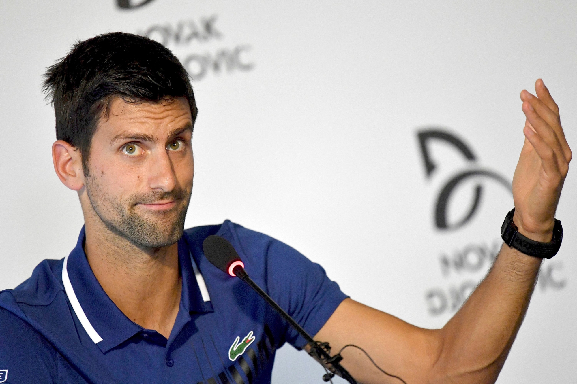 Tennis player Novak Djokovic gestures,  during a press conference in Belgrade, Serbia, Wednesday, July 26, 2017.  Djokovic will sit out the rest of this season because of an injured right elbow, meaning he will miss the U.S. Open and end his streak of participating in 51 consecutive Grand Slam tournaments. (Andrej Isakovic, Pool Photo via AP) Serbia Djokovic Season Over