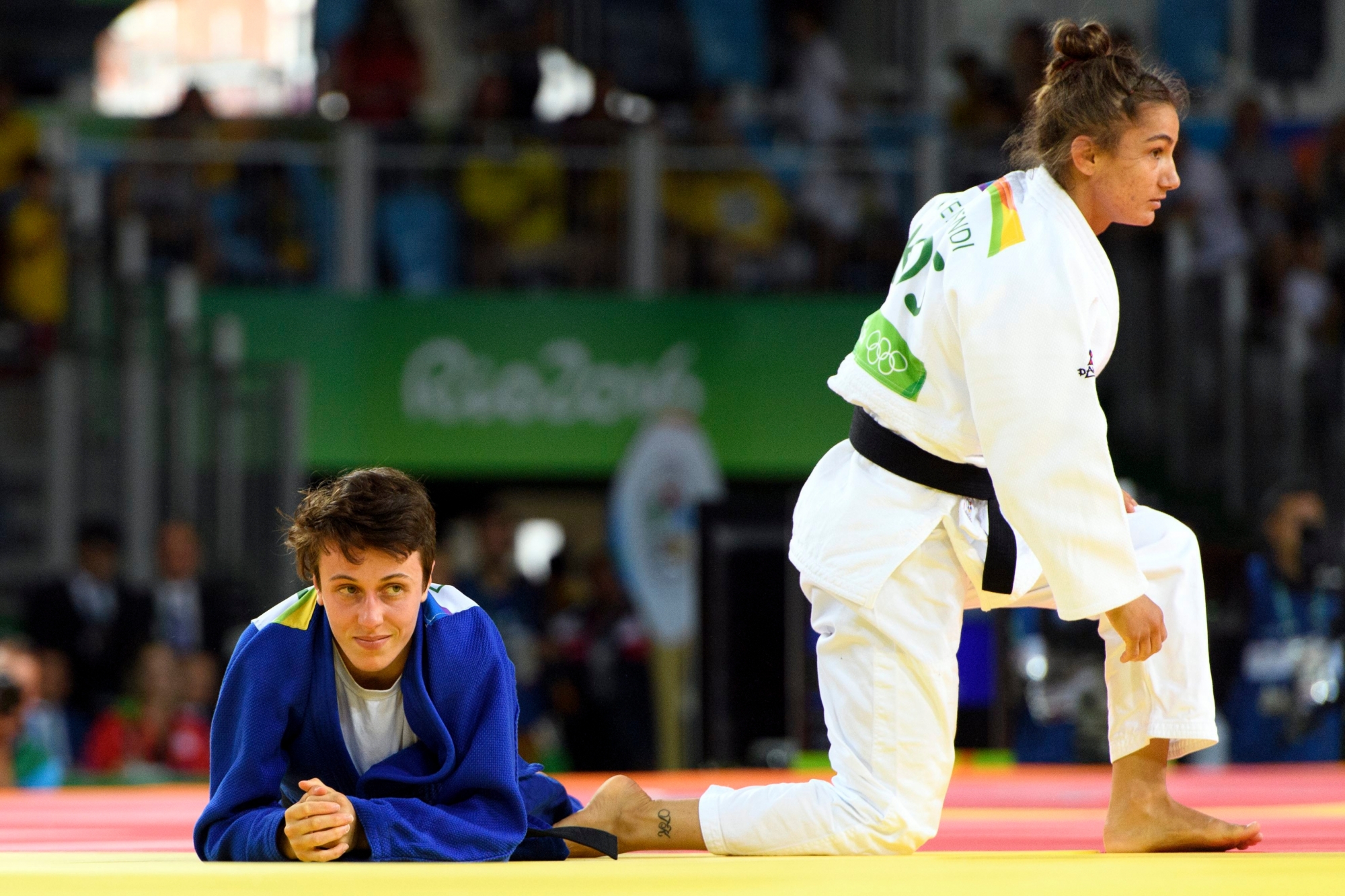 Evelyne Tschopp, left, of Switzerland reacts after loosing against Majlinda Kelmendi, right, of Kosovo during the round of 16 women's 52-kg judo competition at the Carioca Arena 2 in Rio de Janeiro, Brazil, at the Rio 2016 Olympic Summer Games, on Sunday, August 07, 2016. (KEYSTONE/Laurent Gillieron) BRAZIL RIO OLYMPICS 2016 JUDO