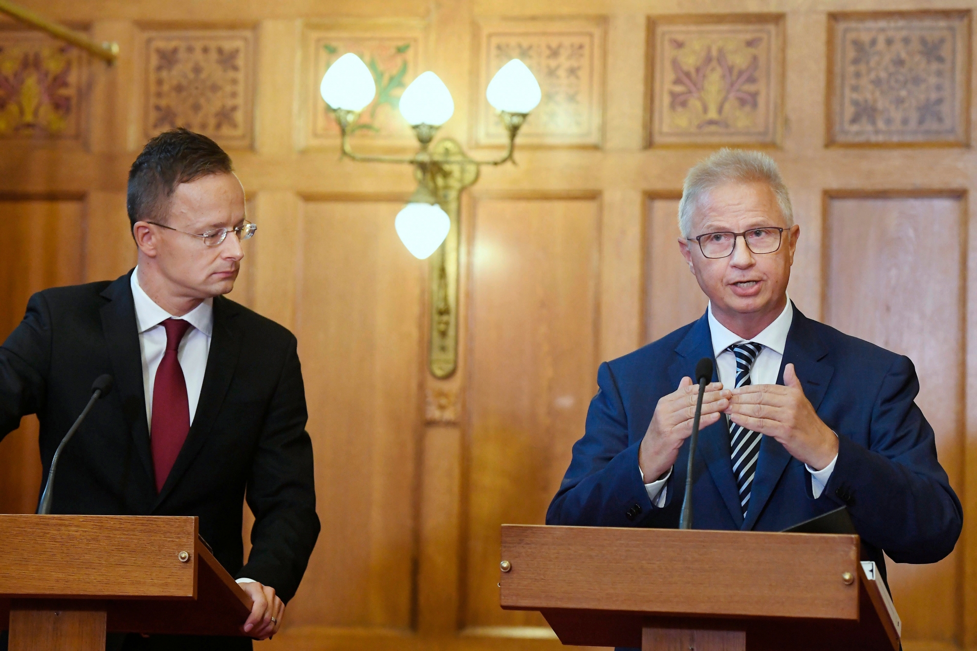 Hungarian Minister of Foreign Affairs and Trade Peter Szijjarto, right, and Hungarian Justice Minister Laszlo Trocsanyi hold a joint news conference after the decision of the Court of Justice of Luxembourg about the EU migrant quotas at the Parliament in Budapest, Hungary, Wednesday, Sept. 6, 2017. (Szilard Koszticsak/MTI via AP) Europe Migrants