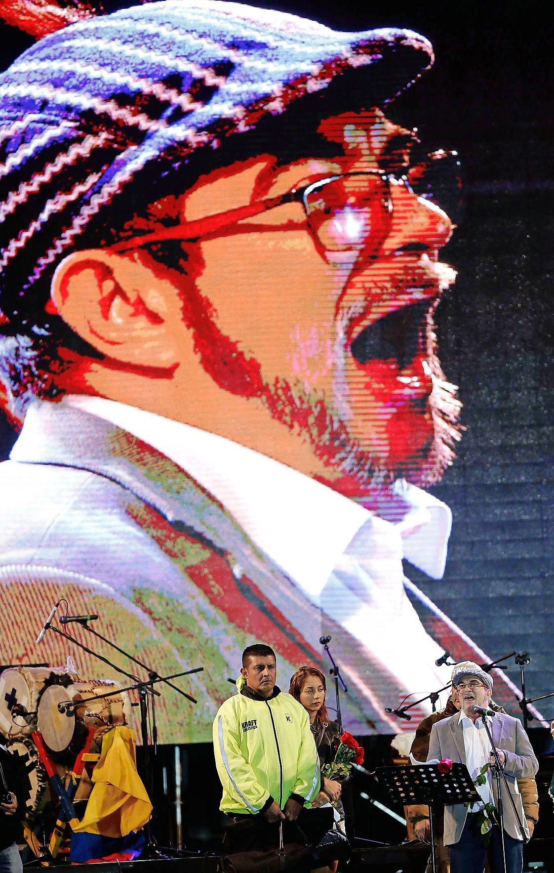 Leader of the former Revolutionary Armed Forces of Colombia, FARC, leader Rodrigo Londono, also known as Timoleon Jimenez or Timochenko, center, speaks during the party congress, as the FARC transitions into a political party, in Bogota, Colombia, Friday, Sept., 1, 2017. Members of the Revolutionary Armed Forces of Colombia, or FARC, voted overwhelmingly to change the group's name to the Alternative Communal Revolutionary Forces, scrubbing any reference to its armed past. (AP Photo/Fernando Vergara) Colombia Rebel Party