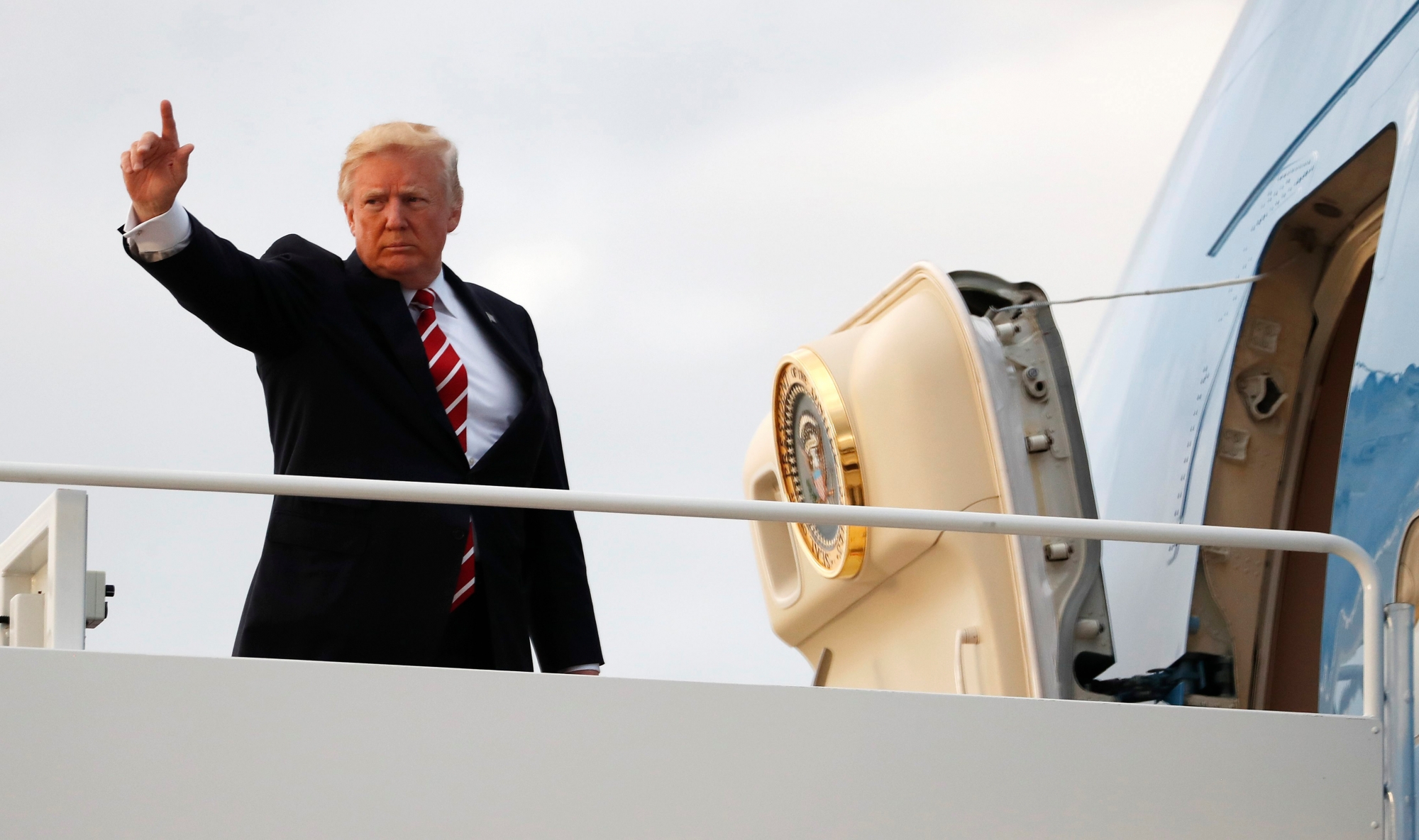 President Donald Trump boards Air Force One, Saturday, Oct. 7, 2017, at Andrews Air Force Base, Md., en route to a fundraiser in Greensboro, N.C.. (AP Photo/Carolyn Kaster) Trump