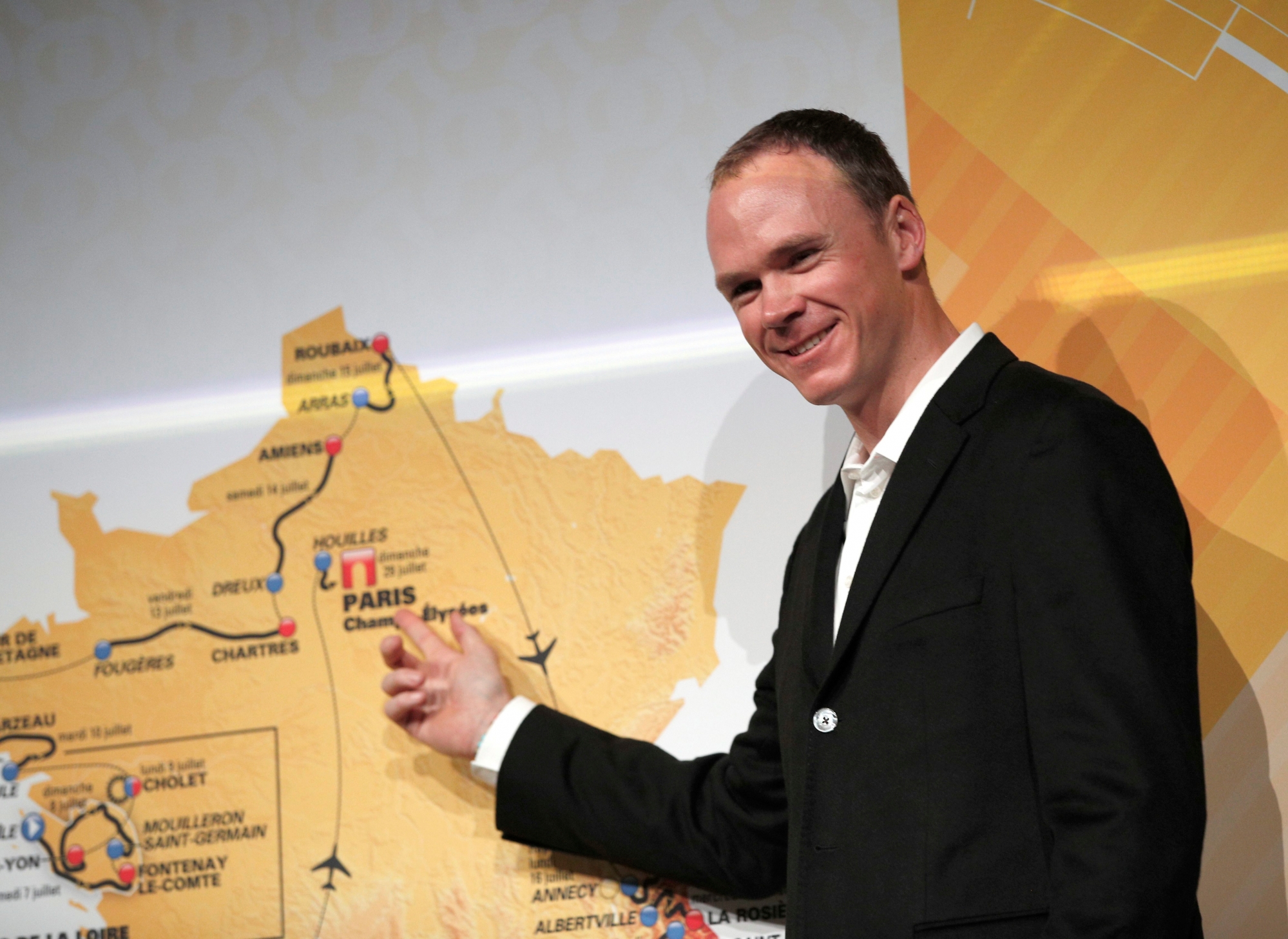Britain's Chris Froome poses in front of the the road-map during the presentation of the 2018 Tour de France cycling race, in Paris, Tuesday Oct. 17, 2017. The 105th edition of the race starts on July 7 2018 to end on the Champs-Elysees avenue on July 29. (AP Photo/Christophe Ena) France Cycling Tour de France