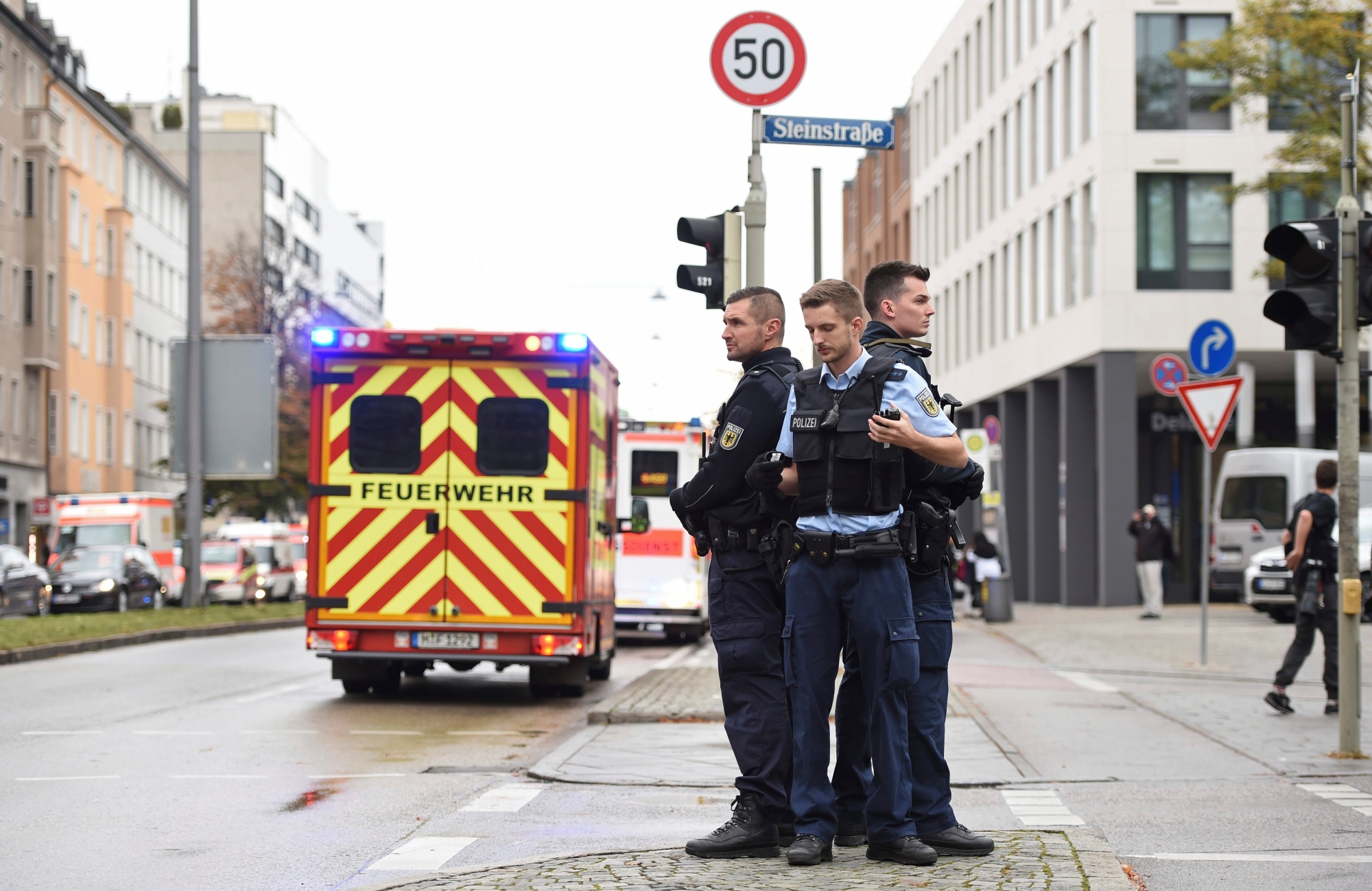Police guard the area at Rosenheimer Platz square in Munich, Germany, Saturday, Oct. 21, 2017. Police say a man with a knife has lightly wounded several  people in Munich. Officers are looking for the assailant. Munich police called on people in the Rosenheimer Platz  square area, located close to the German city's downtown, to stay inside after the incident on Saturday morning. (Andreas Gebert/dpa via AP) Germany Stabbing