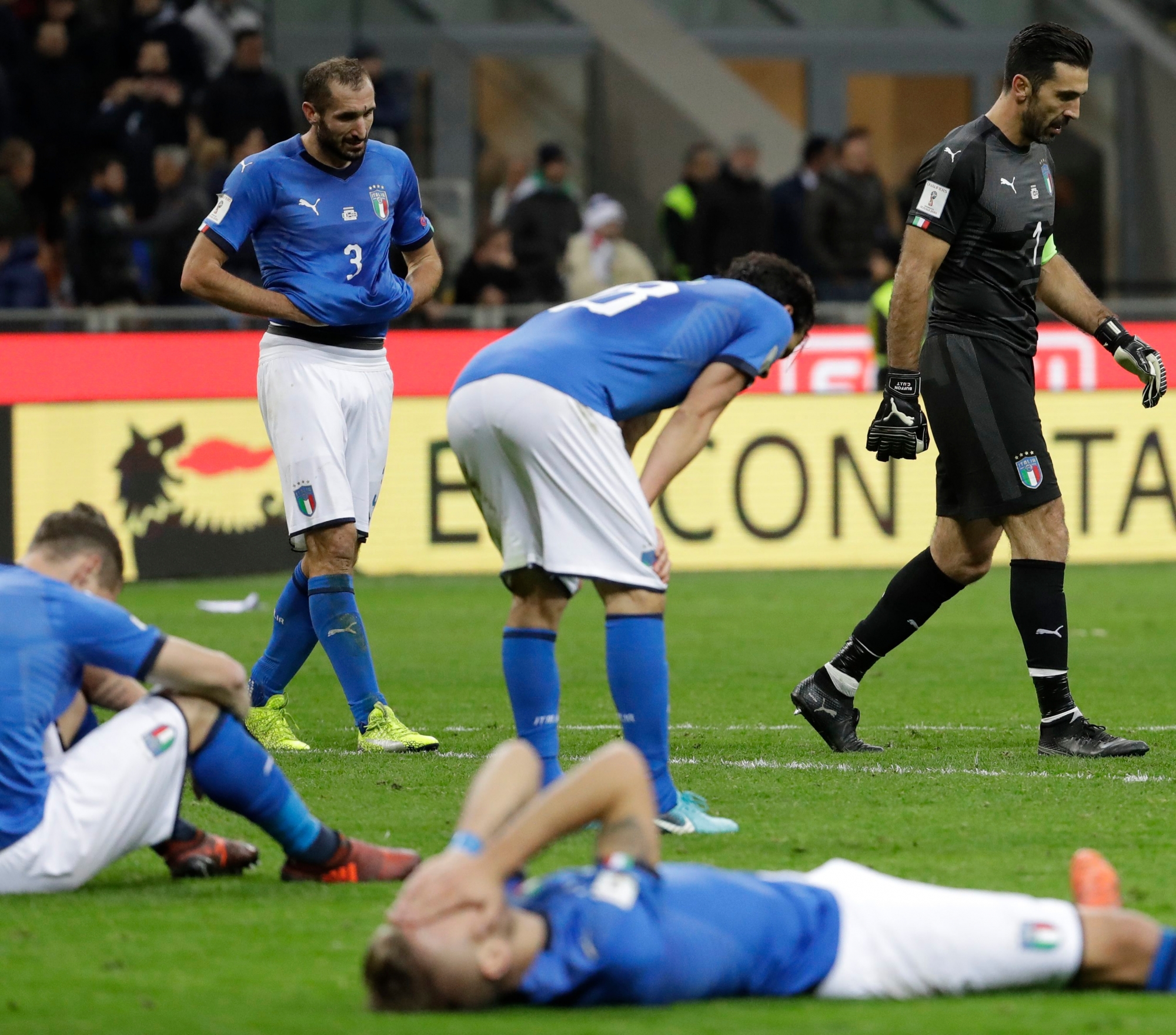 Italian players react to their elimination at the end of the World Cup qualifying play-off second leg soccer match between Italy and Sweden, at the Milan San Siro stadium, Italy, Monday, Nov. 13, 2017. (AP Photo/Luca Bruno) Soccer WCup 2018 Italy Sweden