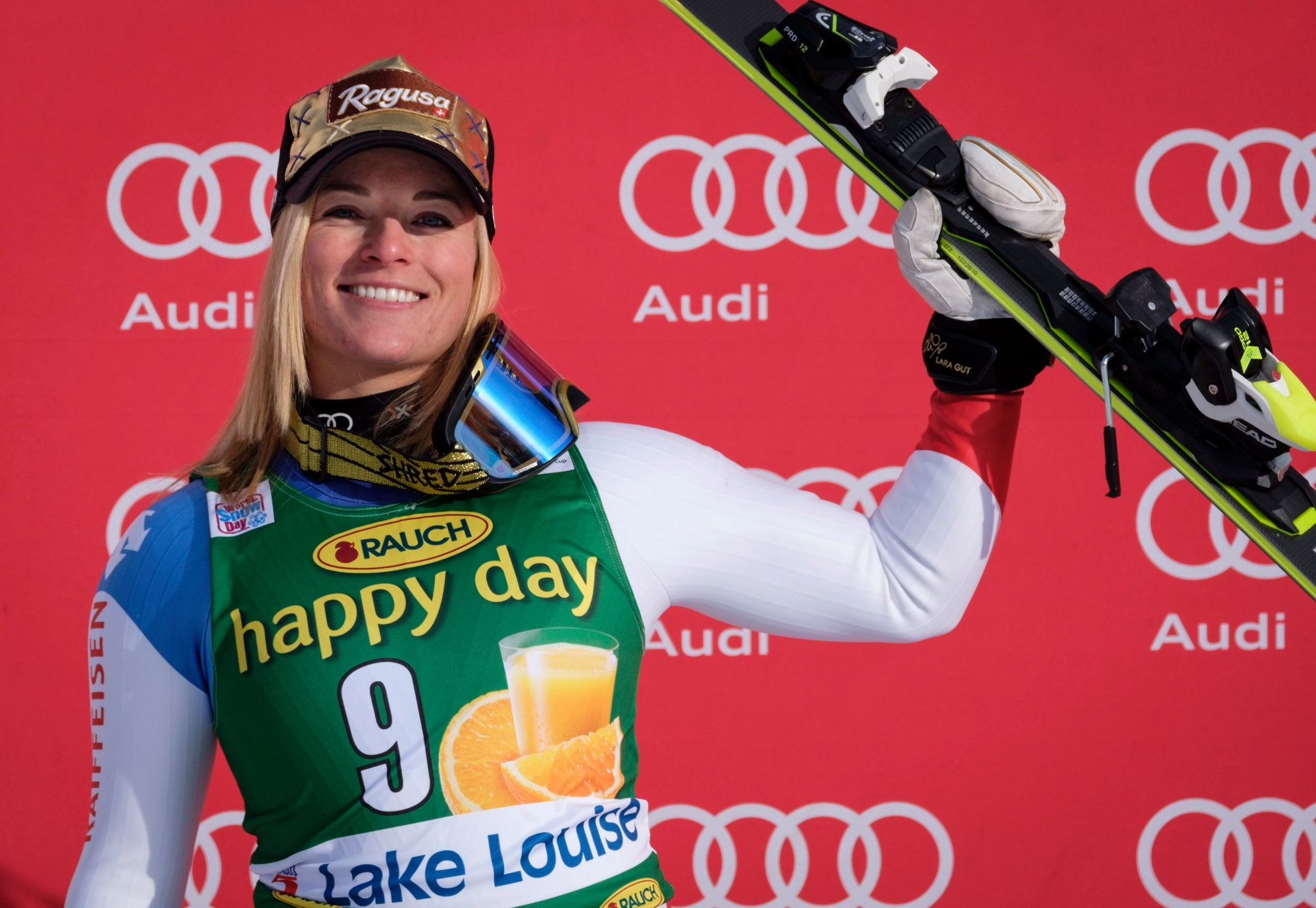 Switzerland's Lara Gut celebrates her second-place finish on the podium following the women's World Cup super-G ski race at Lake Louise, Alberta, Sunday, Dec. 3, 2017. (Jeff McIntosh/The Canadian Press via AP) Canada WCup Womens Super G Skiing