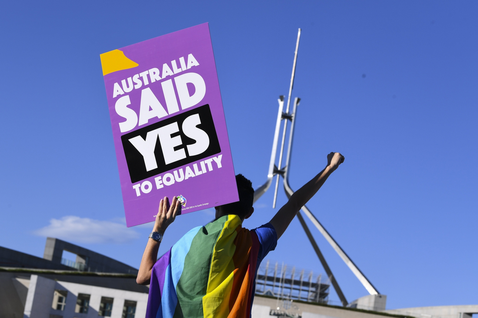 epa06372885 A same-sex marriage campaigner poses for pictures during an equality rally outside Parliament House in Canberra, Australian Capital Territory, Australia, 07 December 2017.  A bill allowing same-sex couples to marry could see its historic pass on the day as the Australian parliament is on its final sitting.  EPA/LUKAS COCH  AUSTRALIA AND NEW ZEALAND OUT AUSTRALIA EQUALITY CAMPAIGN RALLY
