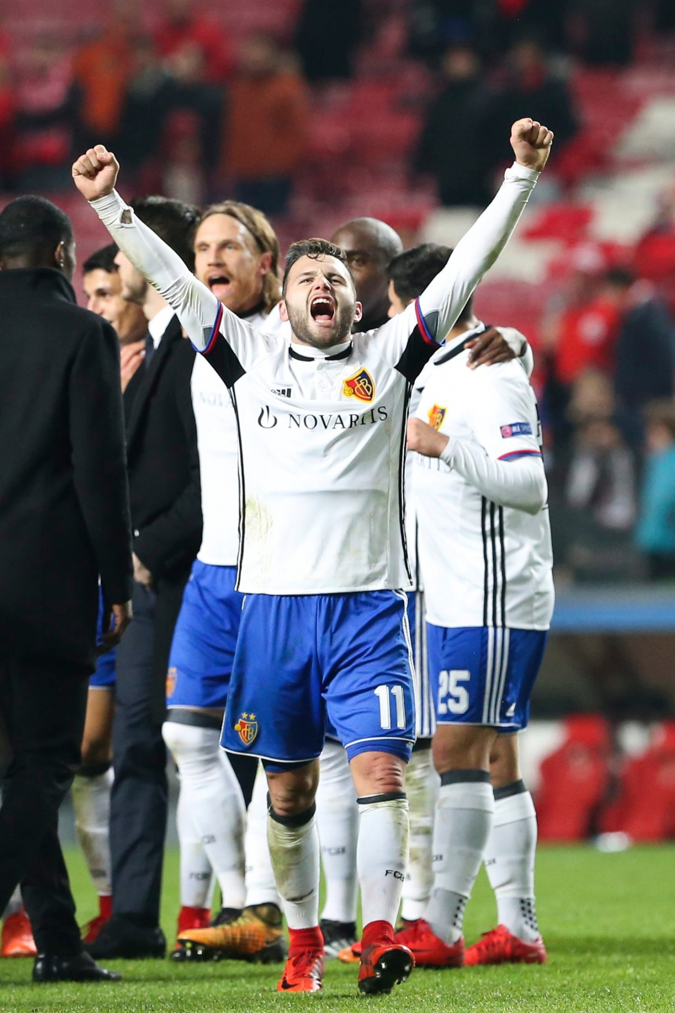 Basel's Renato Steffen, center, celebrates with teammates after the 0-2 win in the Champions League group A soccer match between SL Benfica and FC Basel at the Luz stadium in Lisbon, Tuesday, Dec. 5, 2017. (AP Photo/Armando Franca) Portugal Soccer Champions League