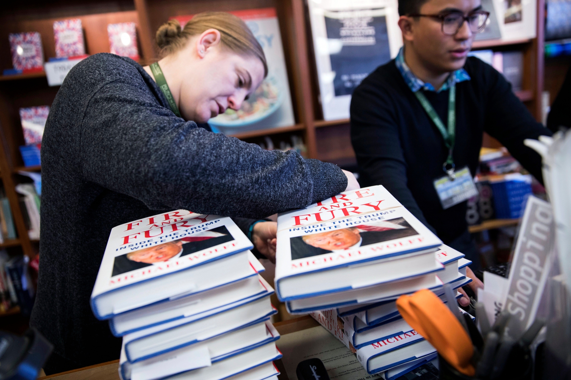 epa06418570 Employees process presold copies of Michael Wolff's book 'Fire and Fury', the tell all about the Trump White House, at Politics and Prose book store in in Washington, DC, USA, 05 January 2018. This morning's release came four days early amid threats of lawsuits from President Trump and his legal team.  EPA/SHAWN THEW USA TRUMP FIRE AND FURY