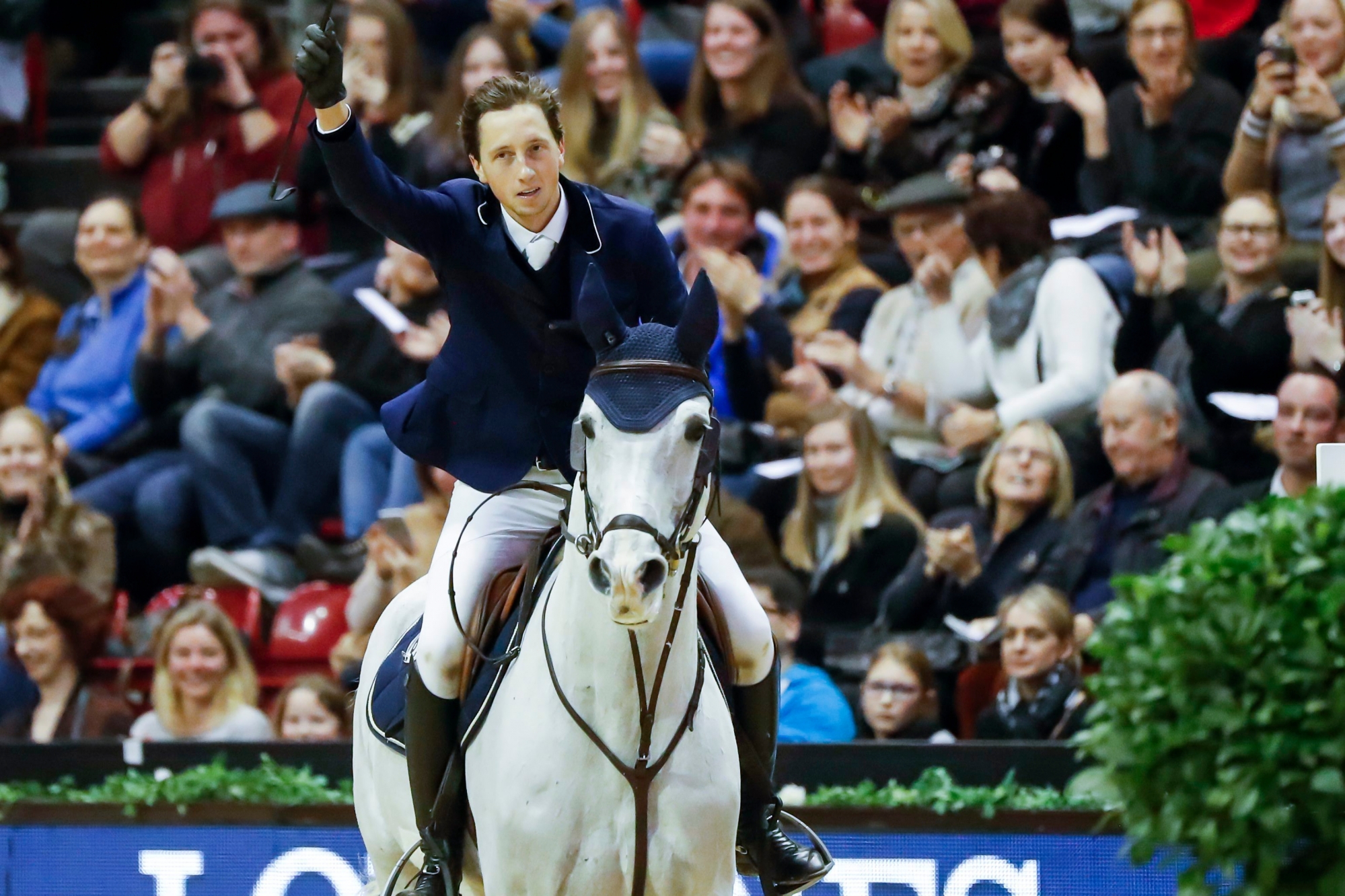 Martin Fuchs from Switzerland rides his horse Clooney and wins the International Longines Grand Prix at CSI Basel in the St. Jakobshalle in Basel, Switzerland, on Sunday, January 14, 2018. (KEYSTONE/Christian Merz) SWITZERLAND HORSE JUMPING CSI BASEL