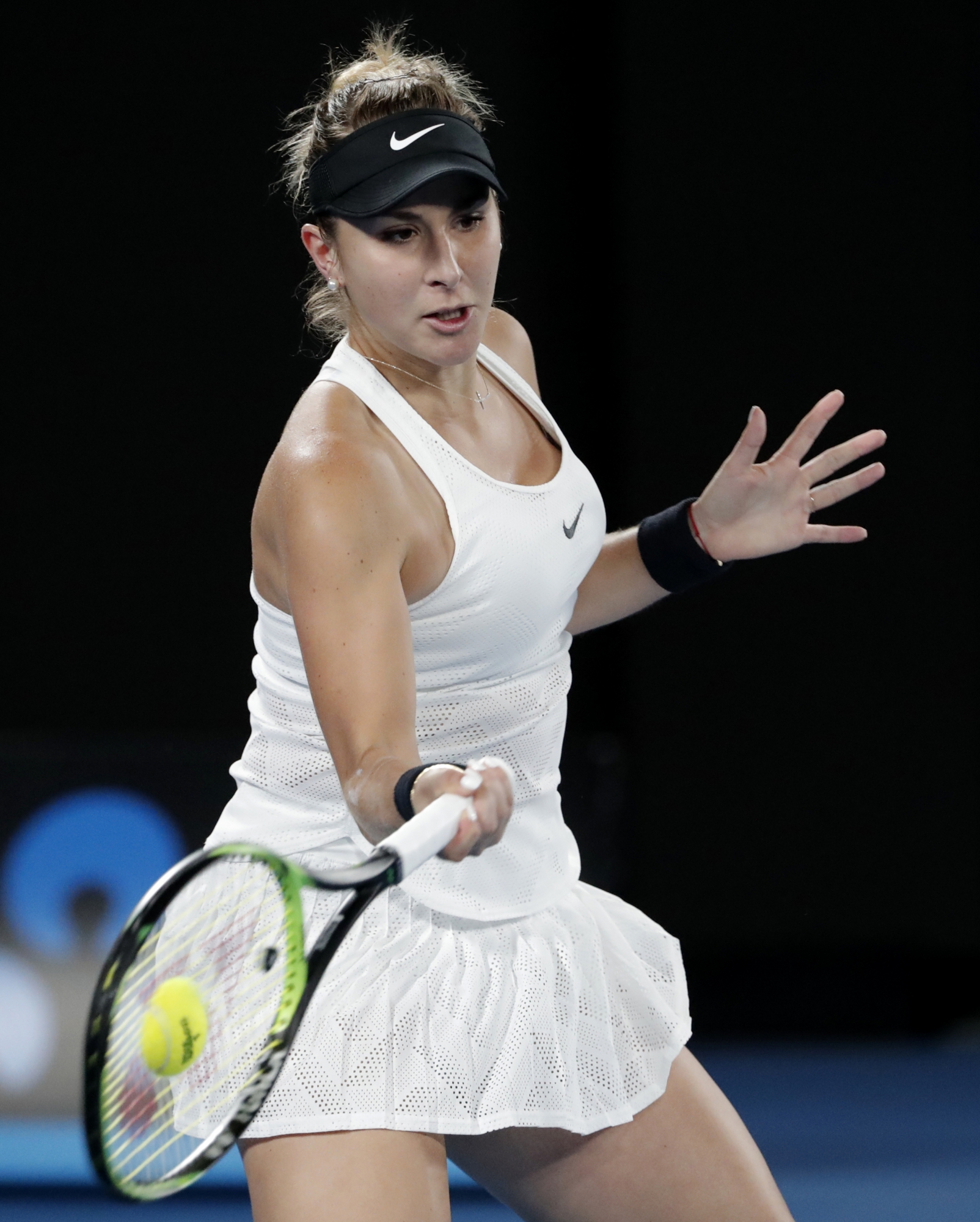 Switzerland's Belinda Bencic makes a forehand return to United States' Venus Williams during their first round match at the Australian Open tennis championships in Melbourne, Australia, Monday, Jan. 15, 2018. (AP Photo/Vincent Thian) Australian Open Tennis