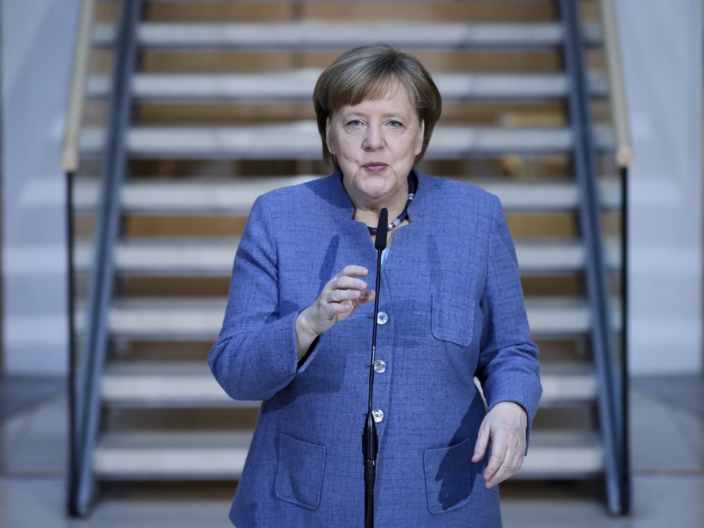 La chancelière conservatrice Angela Merkel bataille avec les sociaux-démocrates pour arracher un accord et sortir l'Allemagne de son impasse post-électorale.