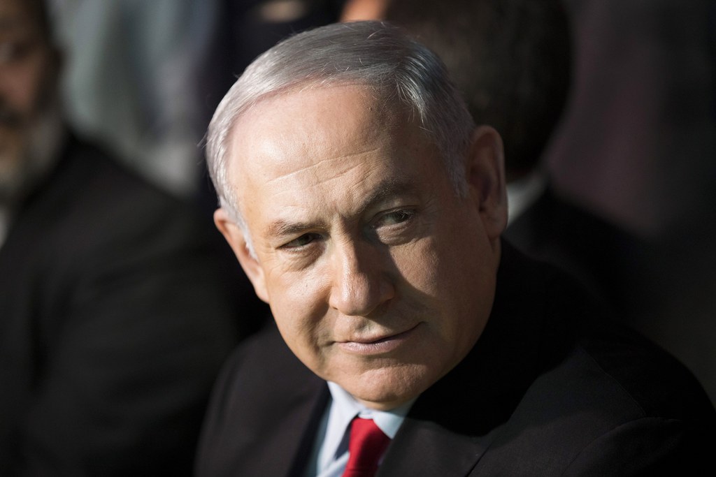 Le rapport de la police est "aussi plein de trous qu'un fromage suisse", a dit M. Netanyahu.