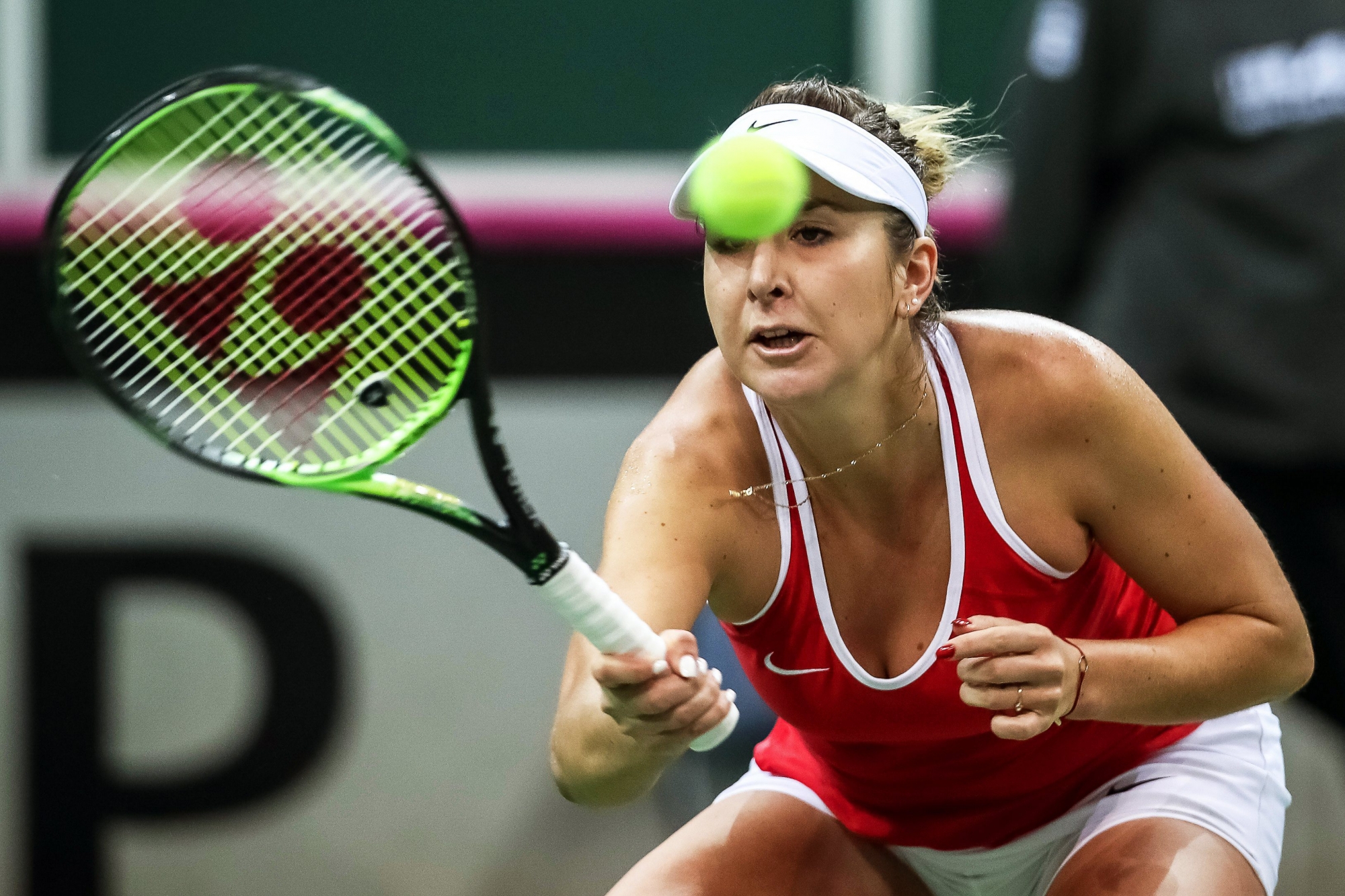 epa06514856 Belinda Bencic of Switzerland in action against Petra Kvitova of the Czech Republic during their singles match of the Tennis Fed Cup World Group first round tie between the Czech Republic and Switzerland in Prague, Czech Republic, 11 February 2018.  EPA/MARTIN DIVISEK CZECH REPUBLIC TENNIS FED CUP