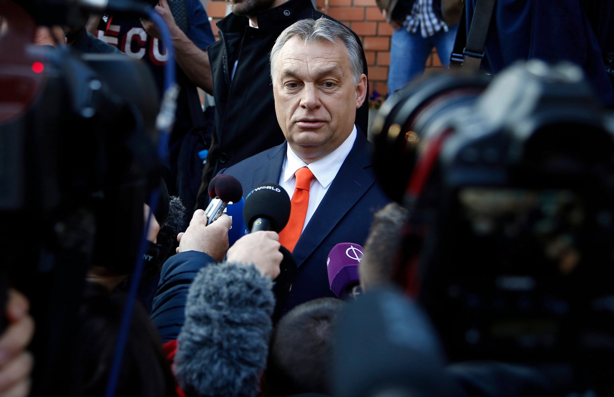 Hungary's prime minister Viktor Orban addresses the media outside a polling station in Budapest, Hungary, Sunday, April 8, 2018. Orban is expected to win his third consecutive term, and fourth overall since 1998, as voting stations opened across the country for the election of 199 parliamentary deputies. (AP Photo/Darko Vojinovic) Hungary Elections