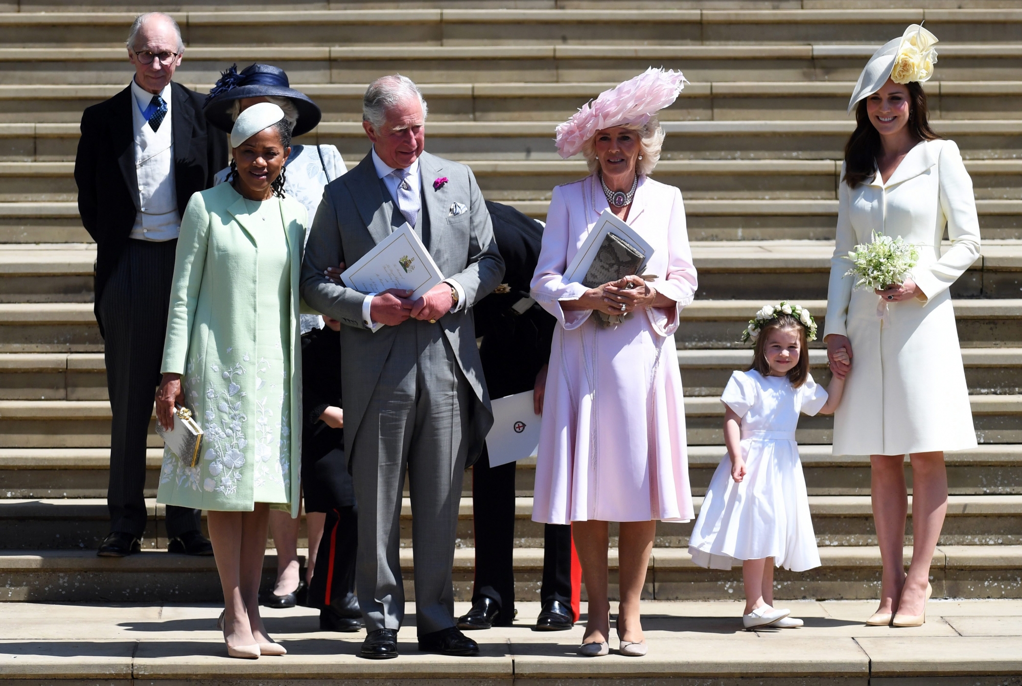 epa06749751 Meghan's mother Doria Ragland (L), Britain's Prince Charles (2-L), Camilla (C) the Duchess of Cornwall, Catherine (R), Duchess of Cambridge and Princess Charlotte (2-R) leave St George's Chapel in Windsor Castle after the royal wedding ceremony of Prince Harry, Duke of Sussex and Meghan, Duchess of Sussex in Windsor, Britain, 19 May 2018. The couple have been bestowed the royal titles of Duke and Duchess of Sussex on them by the British monarch.  EPA/NEIL HALL / POOL