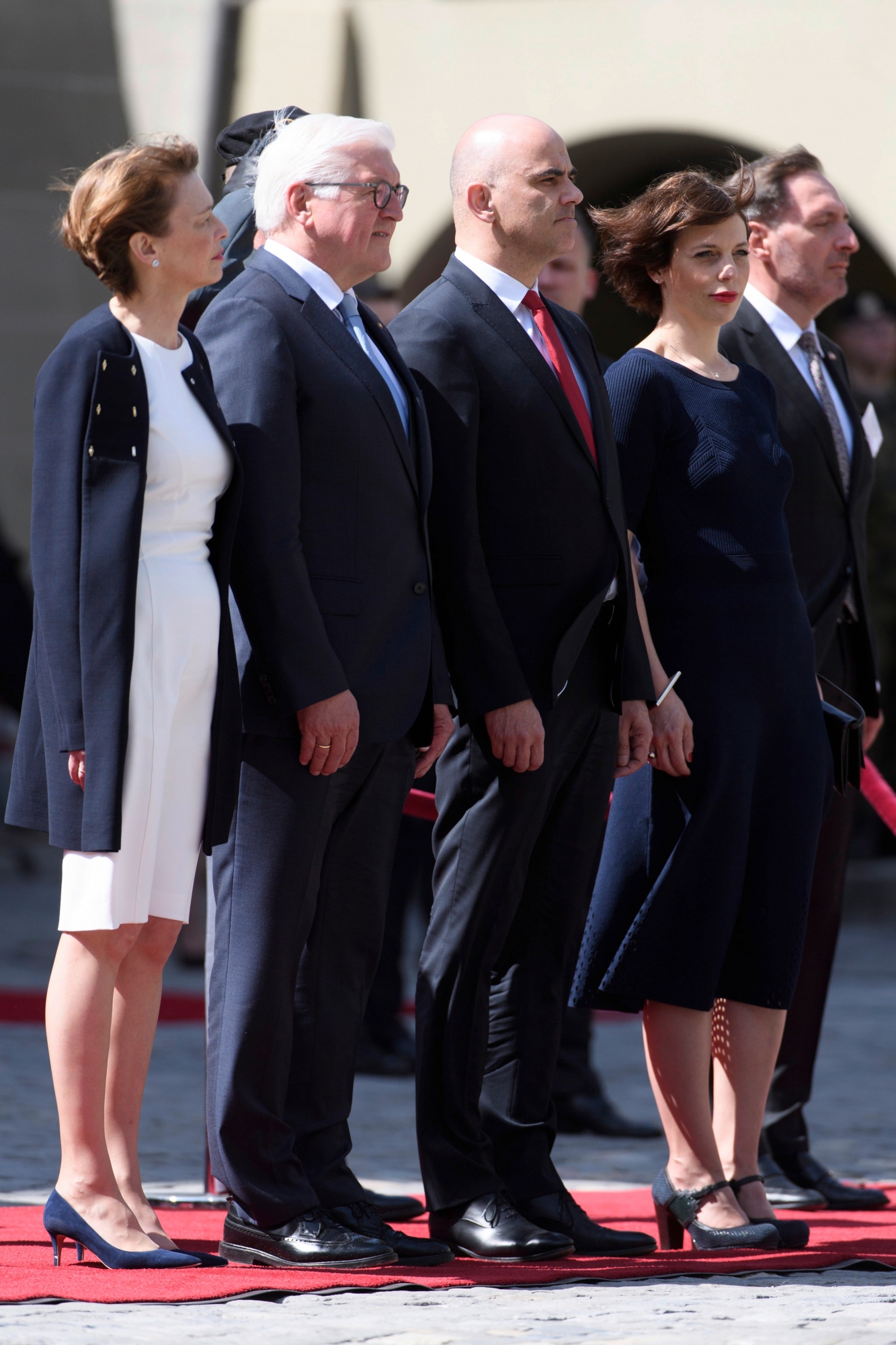 German President Frank-Walter Steinmeier, second-left, and his wife Elke Buedenbender, left, and Swiss Federal President Alain Berset, second-right, and his wife Muriel Zeender Berset, left, listen the national anthem during his two days state visit to Switzerland in Bern Wednesday, April 25, 2018. (KEYSTONE/Anthony Anex) SWITZERLAND GERMANY STATE VISIT