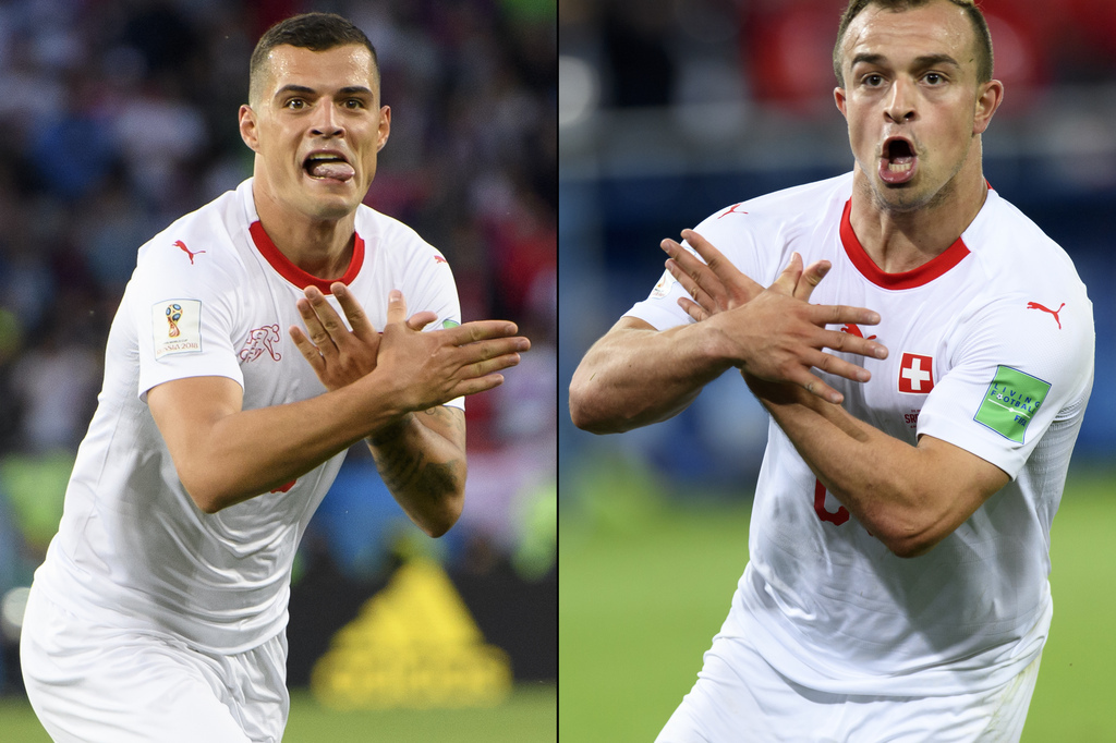 A combo of two pictures shows the celebration for the first goal of Switzerland's midfielder Granit Xhaka, left, and the victory goal of Switzerland's midfielder Xherdan Shaqiri, right, both making the eagle emblem of the Kosovo during the FIFA World Cup 2018 group E preliminary round soccer match between Switzerland and Serbia at the Arena Baltika Stadium, in Kaliningrad, Russia, Friday, June 22, 2018. (KEYSTONE/Laurent Gillieron)