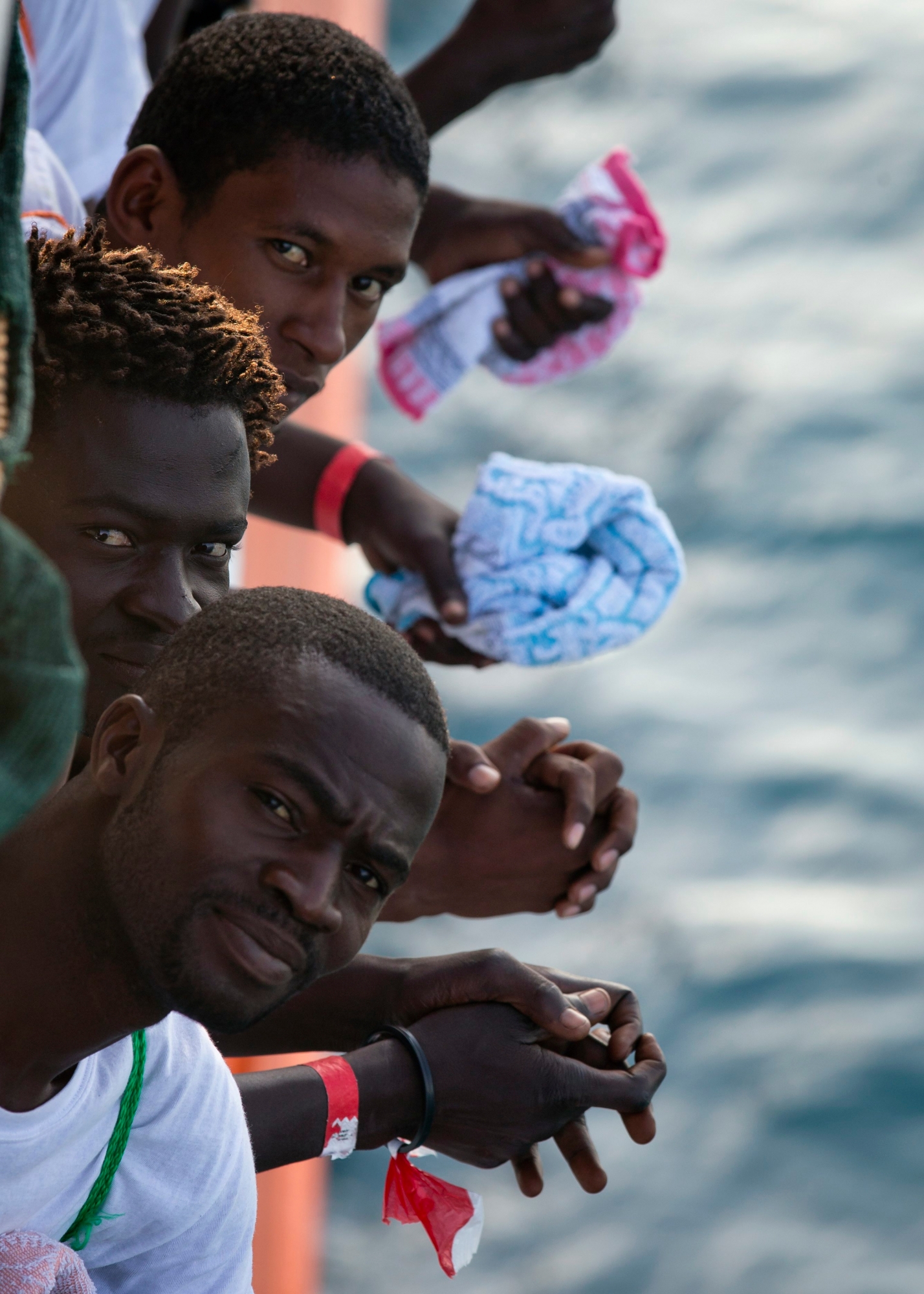 African migrants who were rescued from the Mediterranean Sea north of Libyan coast, look from the deck as the Aquarius vessel of SOS Mediterranee and MSF (Doctors Without Borders) NGOs, approaches the port of Pozzallo on Sicily, Italy, Friday, Sept. 1, 2017. (AP Photo/Darko Bandic) EU LIBYA MIGRANTS